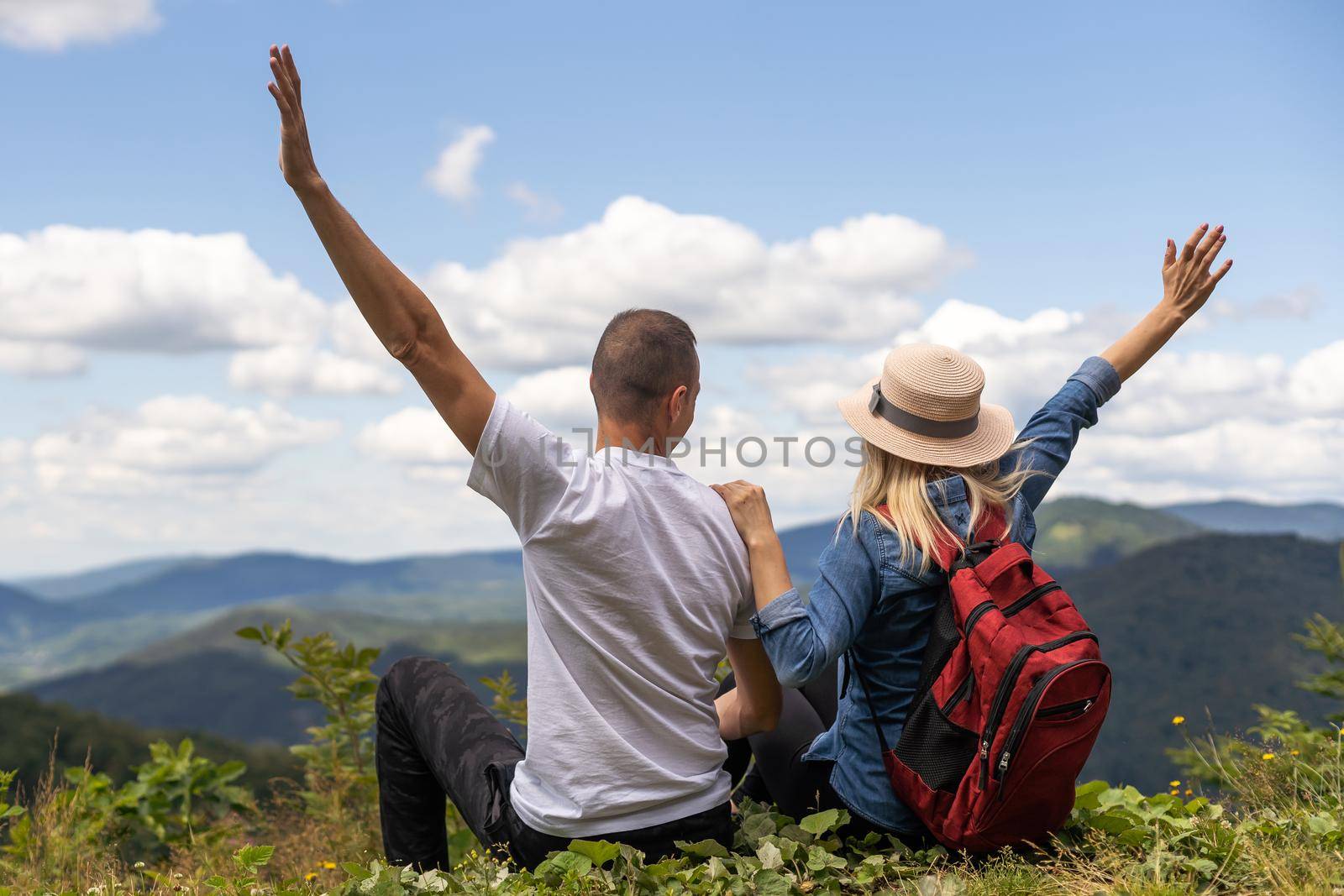 Couple travelers Man and Woman sitting relaxing mountains, view Love and Travel happy emotions Lifestyle concept. Young family traveling active adventure vacations.