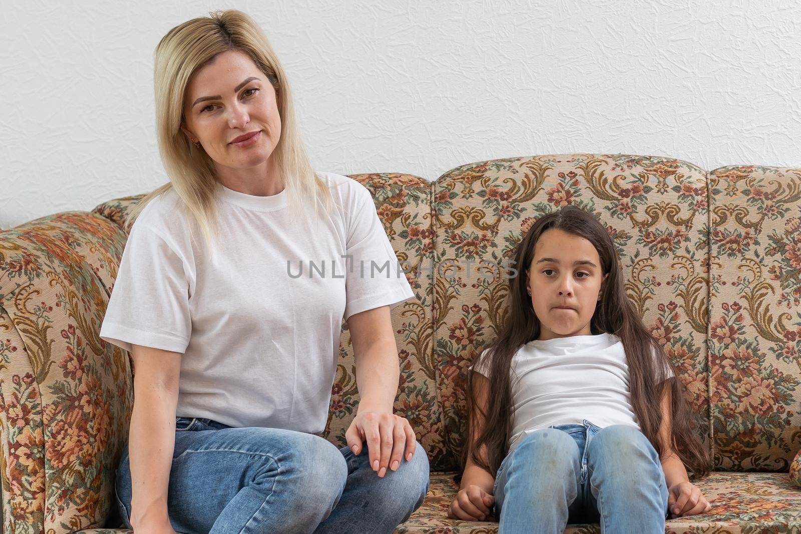 a mother scolds her young daughter.