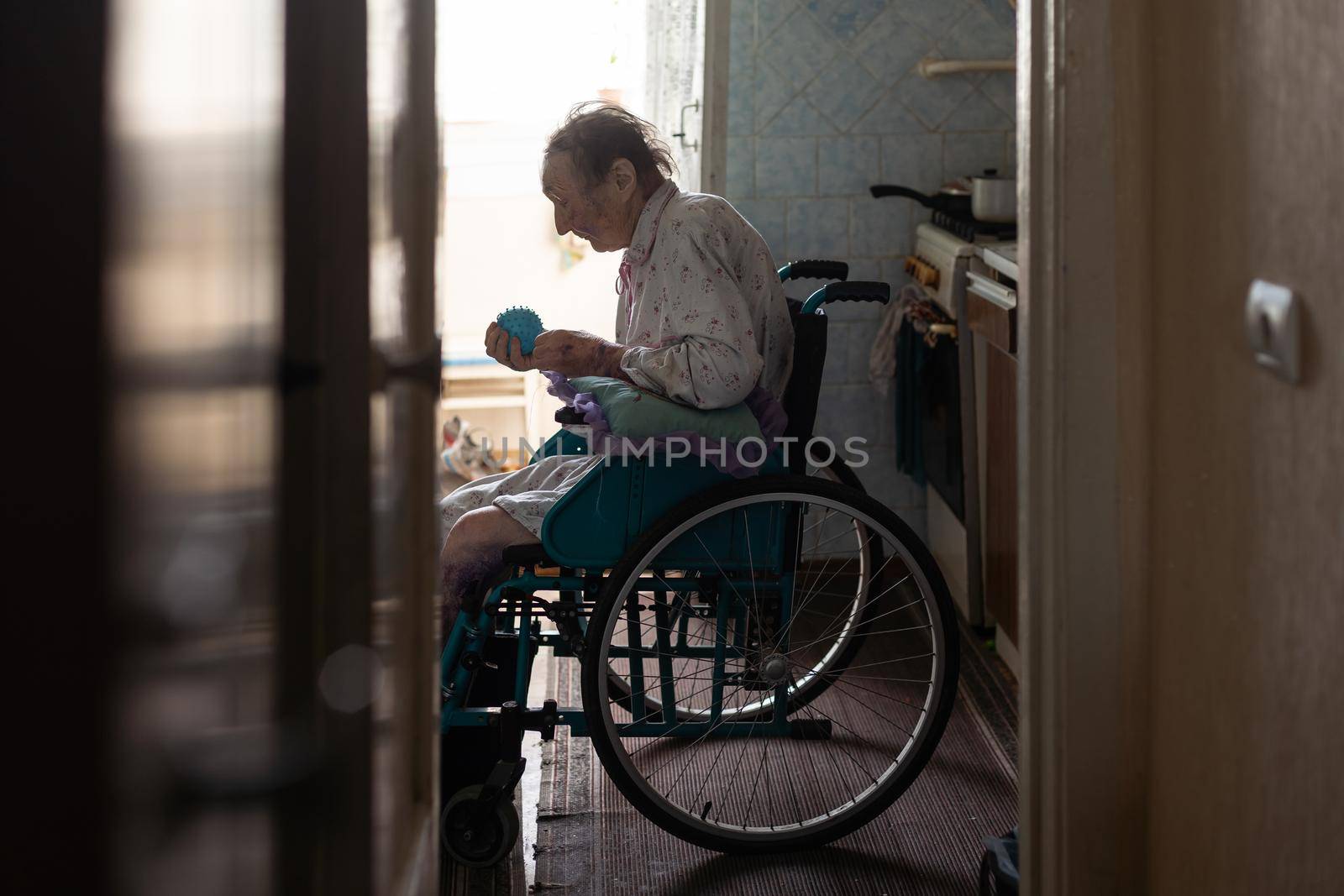 very old woman in a wheelchair.