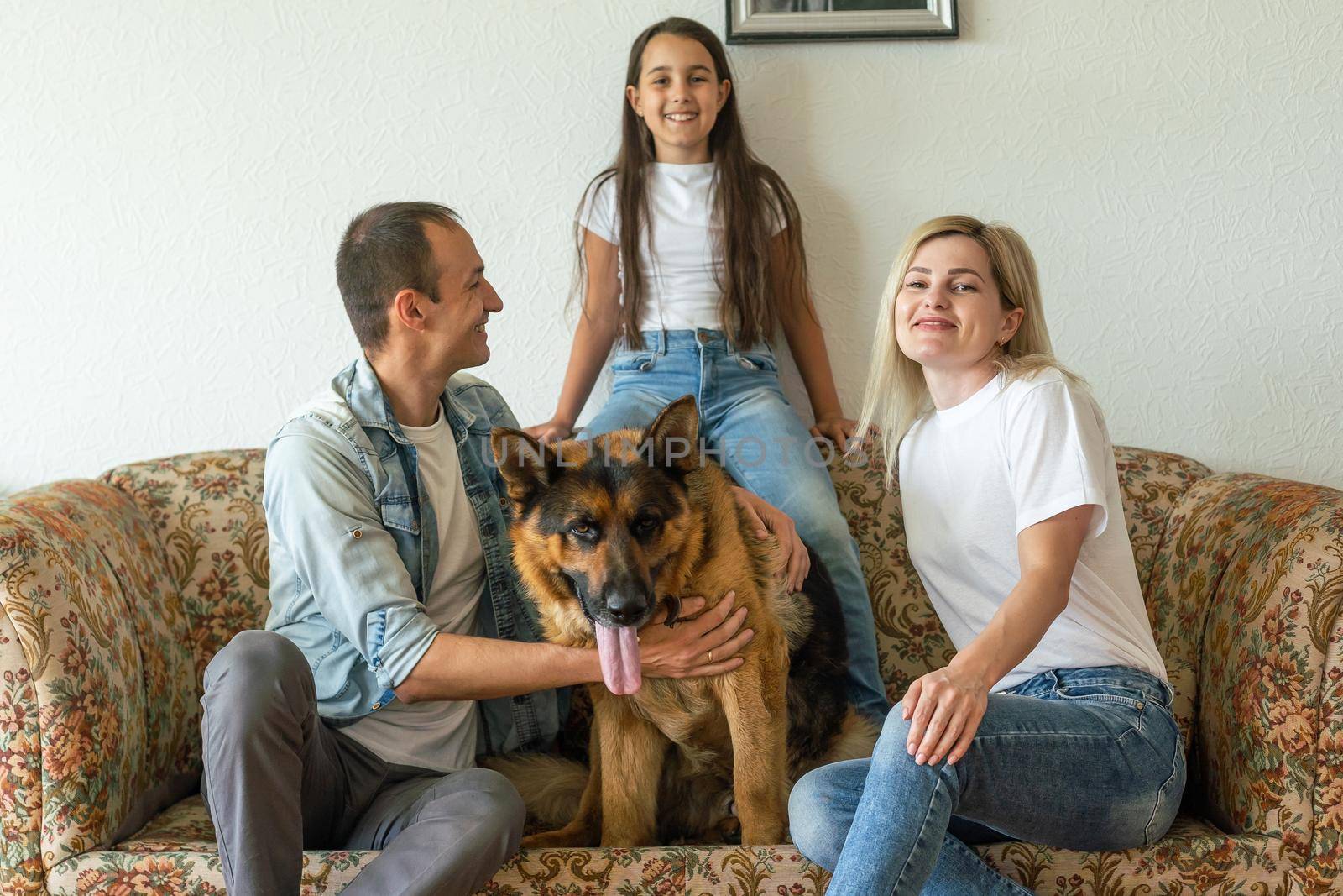 german shepherd and family. German shepherd is the best friend of the child