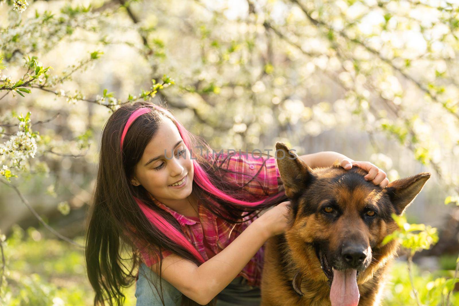 Little cute girl embracing and resting on shoulder dog