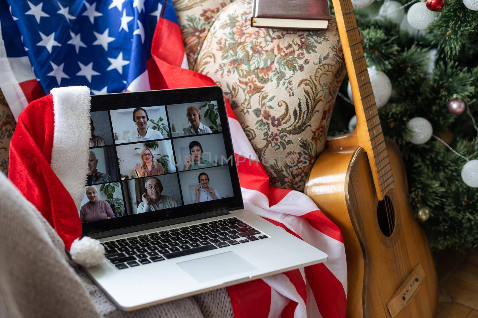 laptop with video chat at christmas and usa flag.