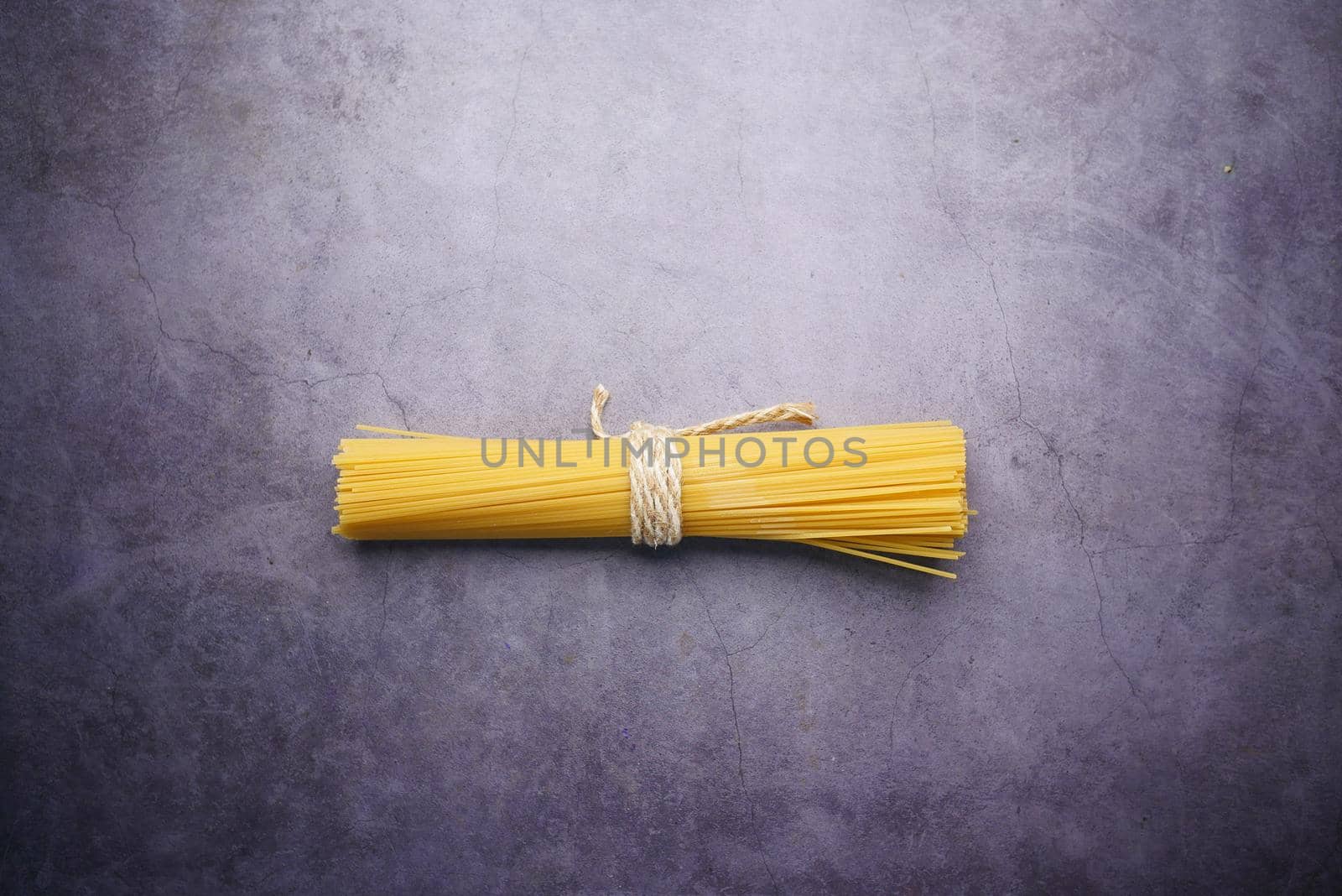 flat congestion of Yellow long spaghetti on black background ,