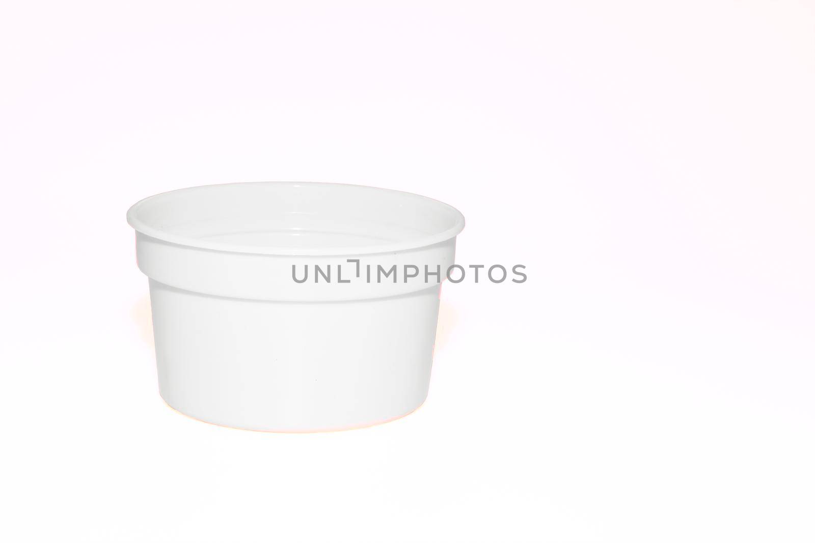 a wide mouthed cylindrical container made of glass or pottery and typically having a lid, used especially for storing product. White plastic jar capacity of isolated on white