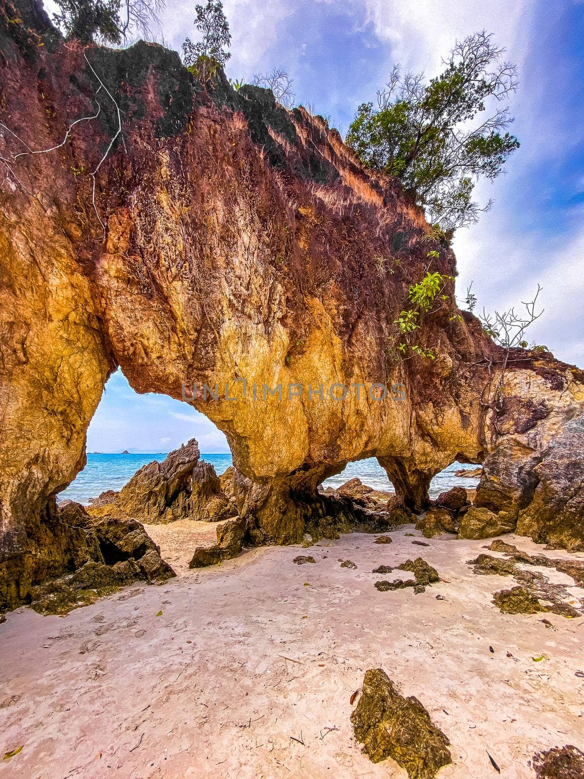 Koh Phayam beach Hin Talu with rock arch formation in Ranong, Thailand. by worldpitou
