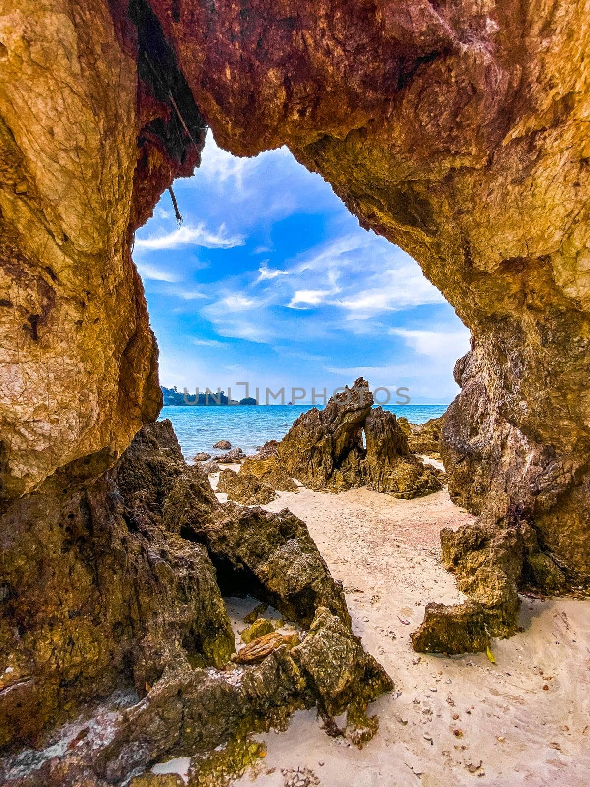 Koh Phayam beach Hin Talu with rock arch formation in Ranong, Thailand. by worldpitou