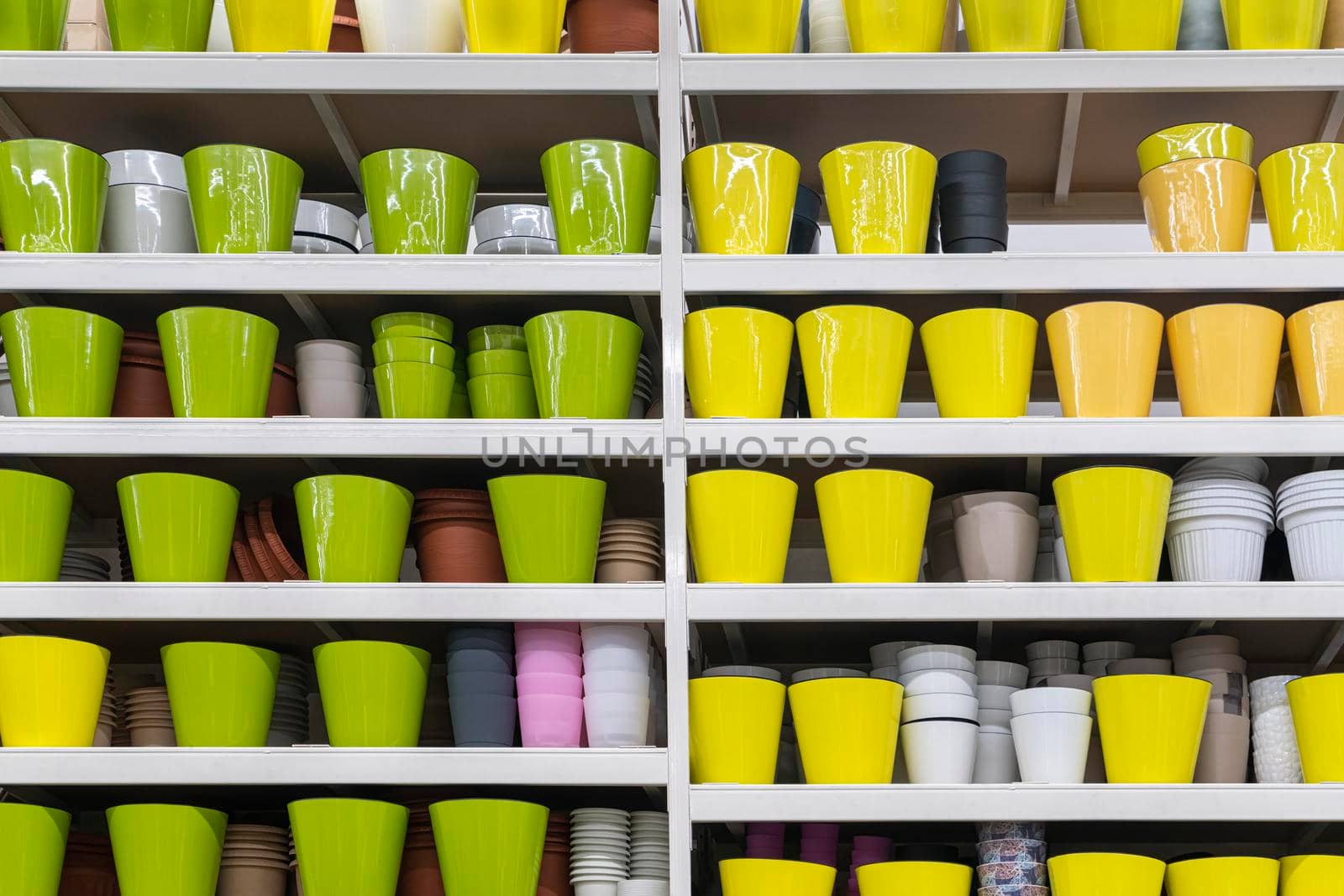 colorful flower pots on the shelves of the store . for the entire frame. High quality photo