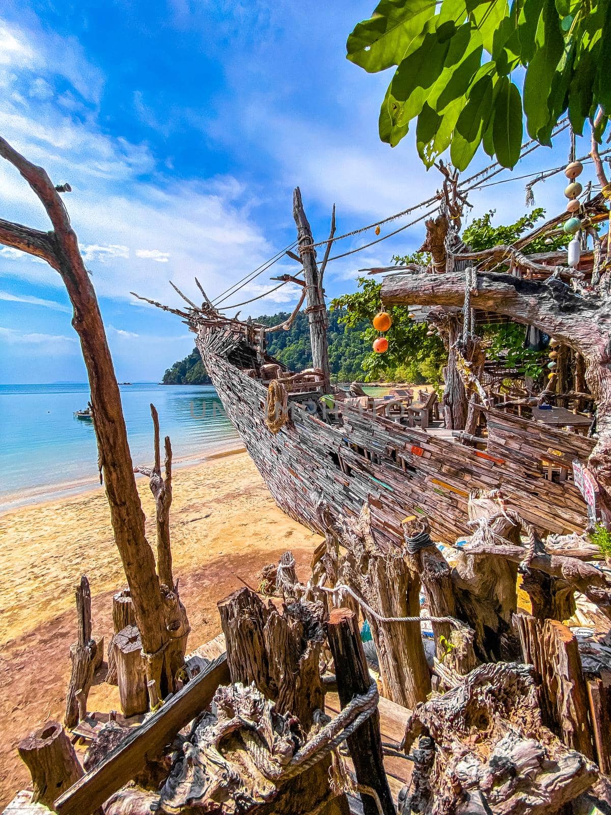 Old wooden pirate boat on the beach in Koh Phayam, Ranong, Thailand, south east asia