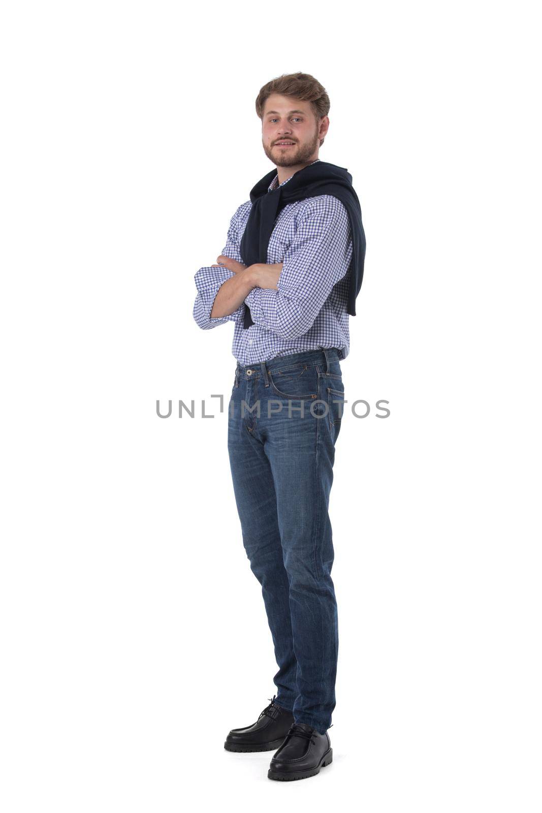 Full length portrait of young business man in casual clothes standing with arms folded isolated on white background