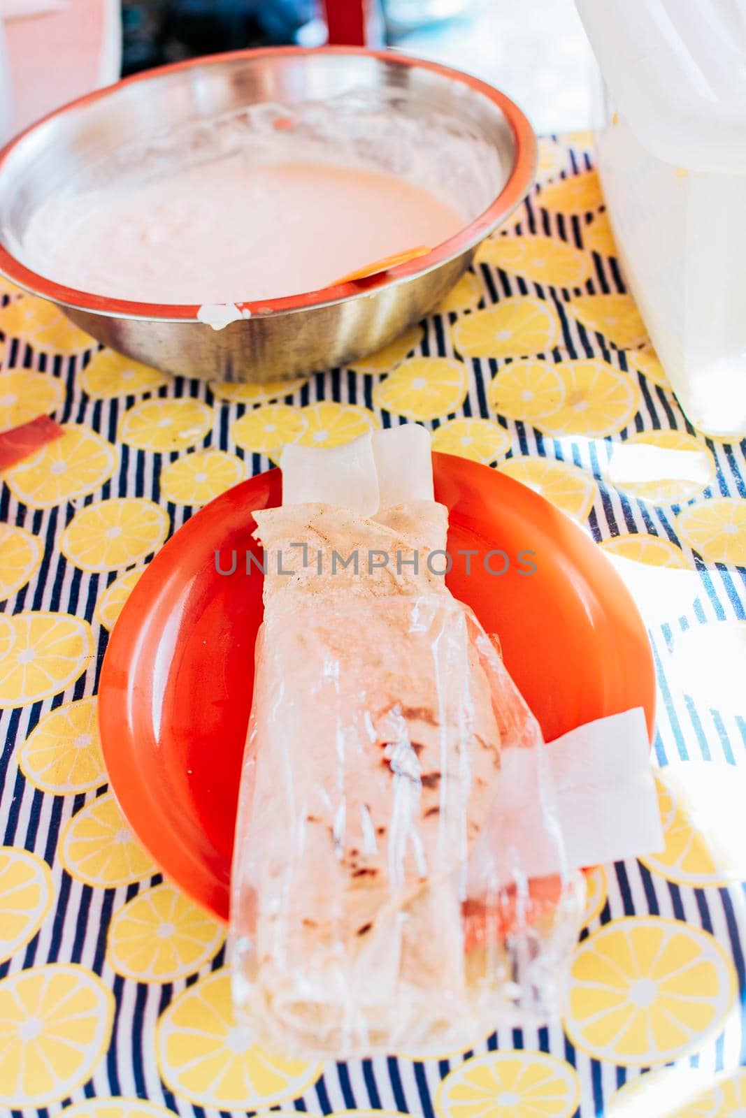Traditional Nicaraguan Quesillo, food Traditional Large Quesillo served on table. Nicaraguan cheese made and served on the table. Traditional cheese with pickled onion and wrapped tortilla. by isaiphoto
