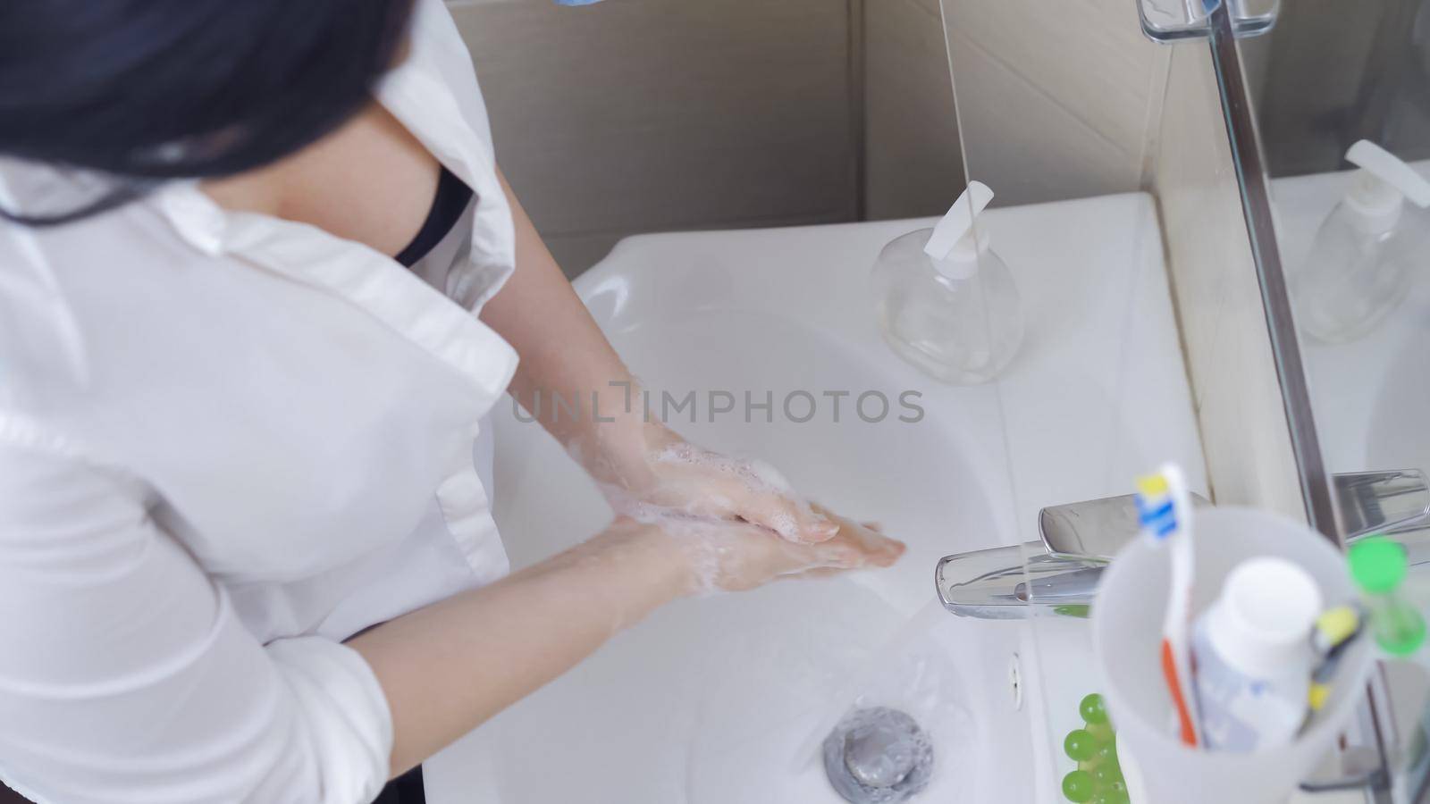 Sexy Woman Washes Her Hands, Woman In White Unbuttoned Shirt Exposes A Soaped Hand Under A Stream Of Water, Good Hygiene During Quarantine, High Angle View