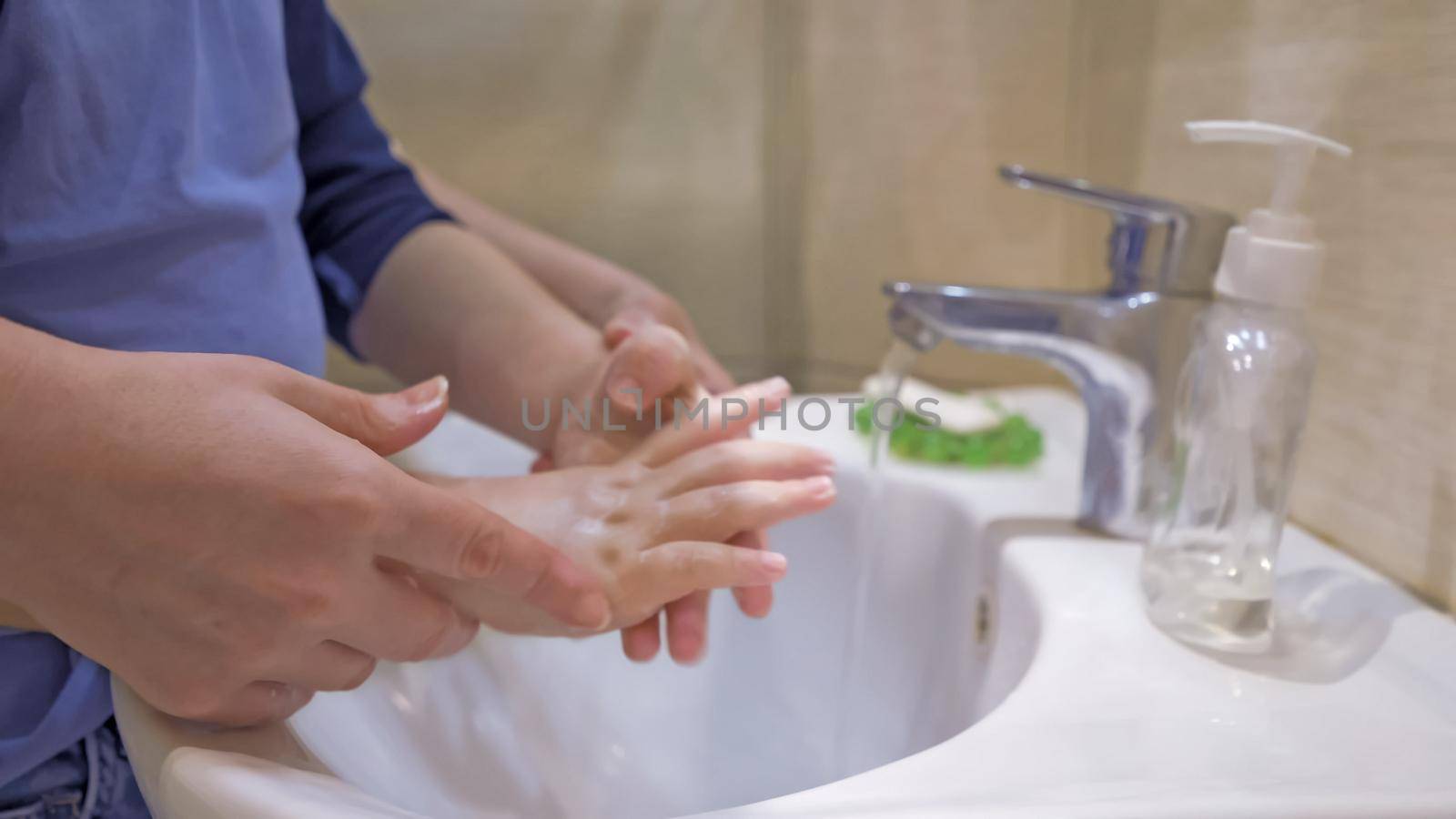 Washing Hands With Mom, Close Up Of Women's Hands Helping The Kid Wash The Soap Well, Boy Soaping Hands And Mom Helps Him Clean His Hands Directing Under Stream Of Water