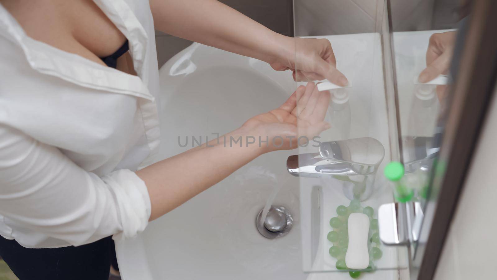 Woman Puts Antibacterial Soap On Her Hands, She Observe Preventive Actions In The Fight For Cleanliness And Being Health During The Coronavirus Epidemic, High Angle View