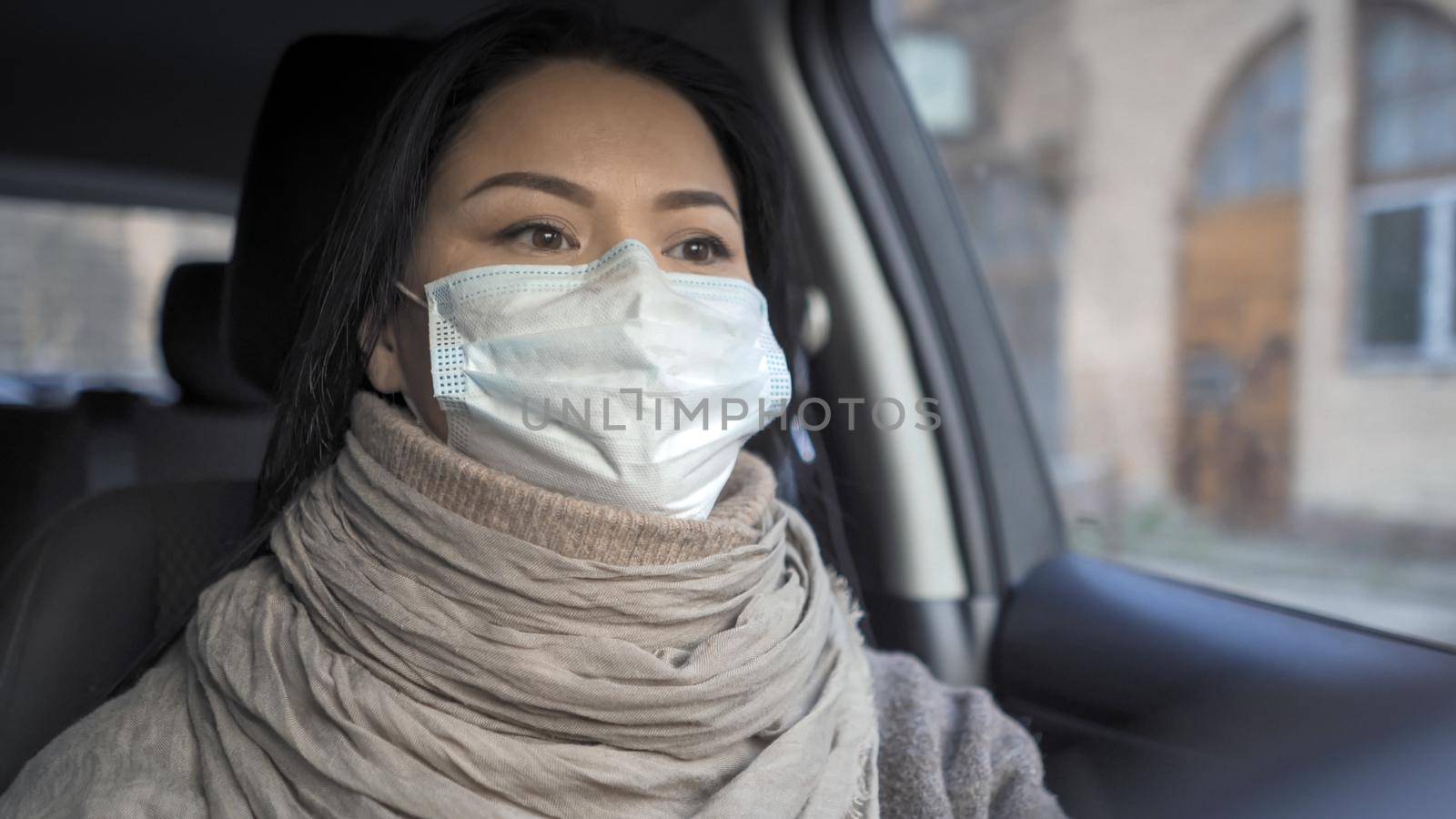 Exhausted Female Medic Drives Car After Hard Day's Work, Asian Woman Sitting In Car And Scared To Go Home, Work In Quarantin Pandemic COVID 19 Days