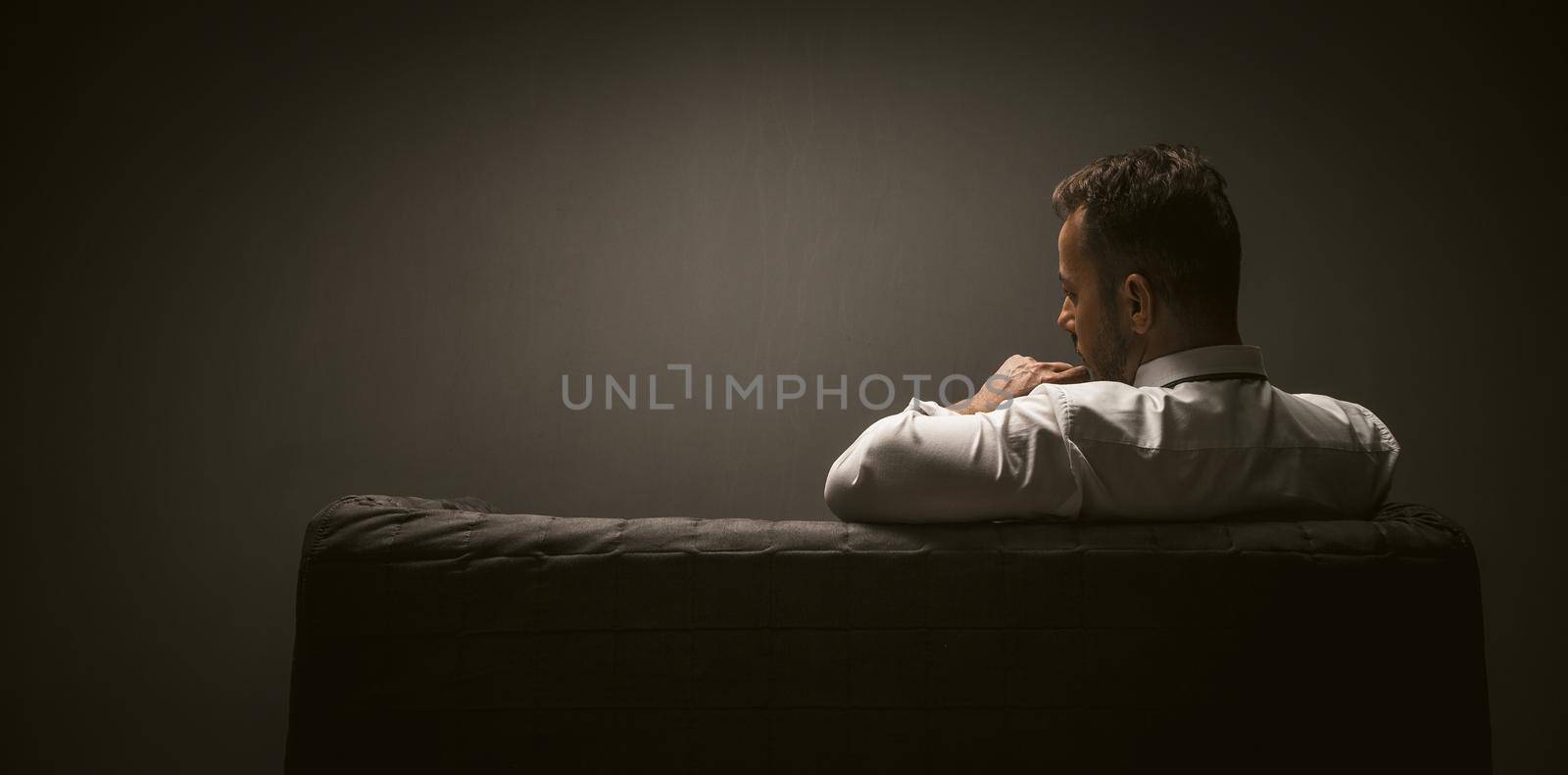 sad American businessman on dark background. Business career concept. Business technology. Depression concept. Business office concept. Modern design. Pandemic depression concept.