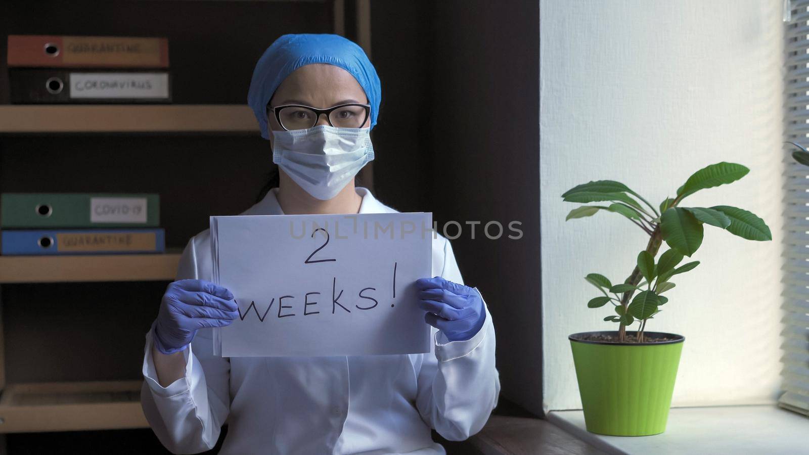 Countdown Signs From Female Doctor In Office by LipikStockMedia