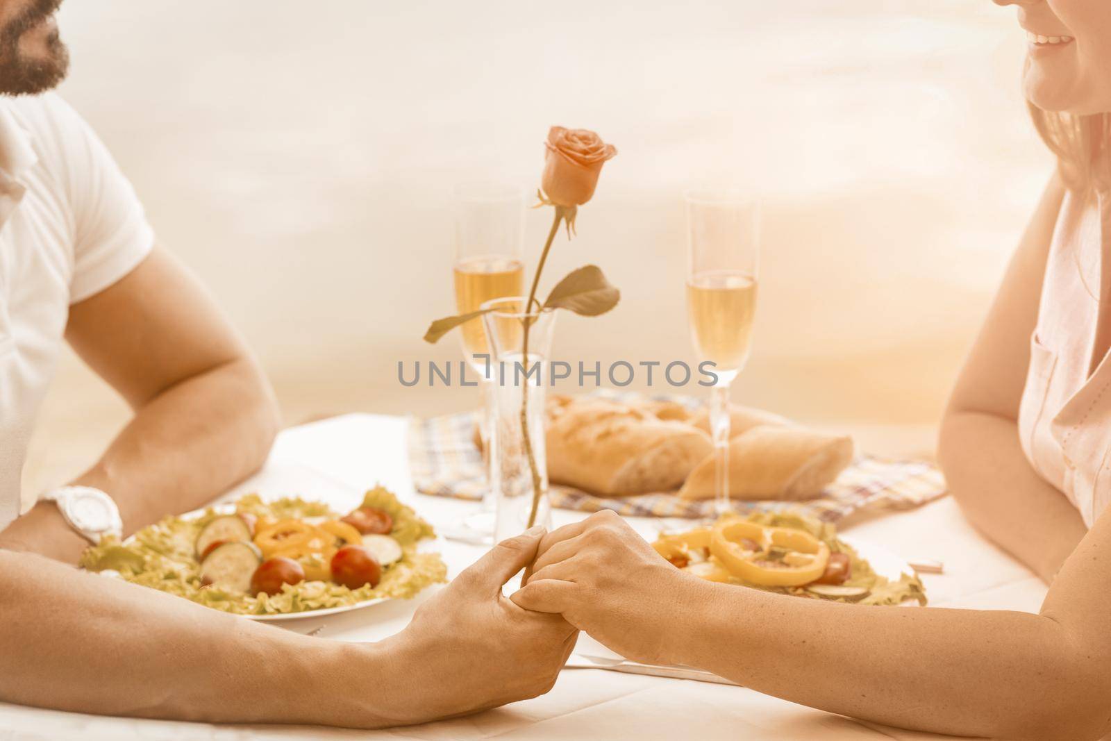 Portrait of loving couple on dinner dating on white backdrop. Relationship concept. Romantic concept. White background by LipikStockMedia