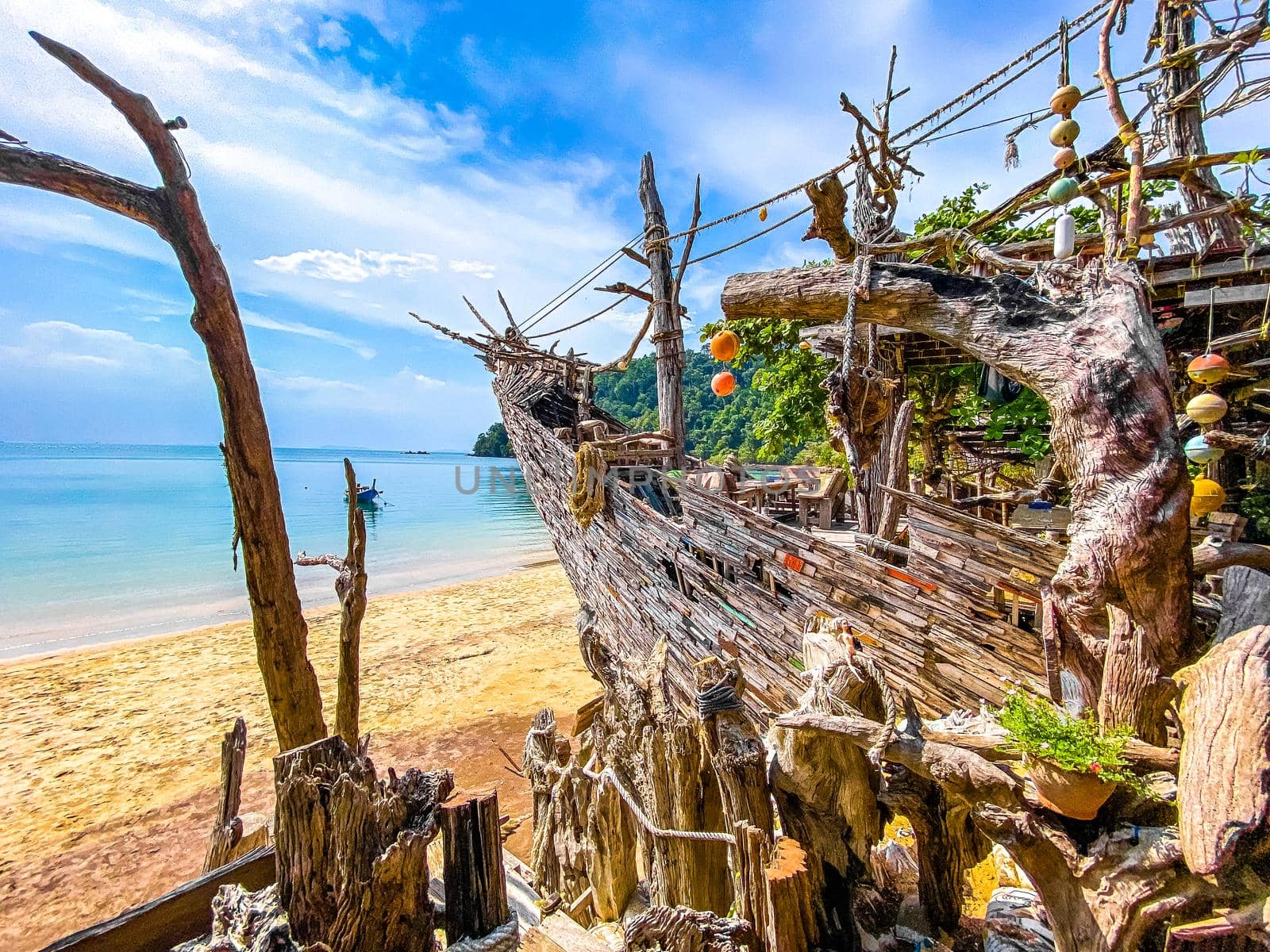 Old wooden pirate boat on the beach in Koh Phayam, Ranong, Thailand, south east asia