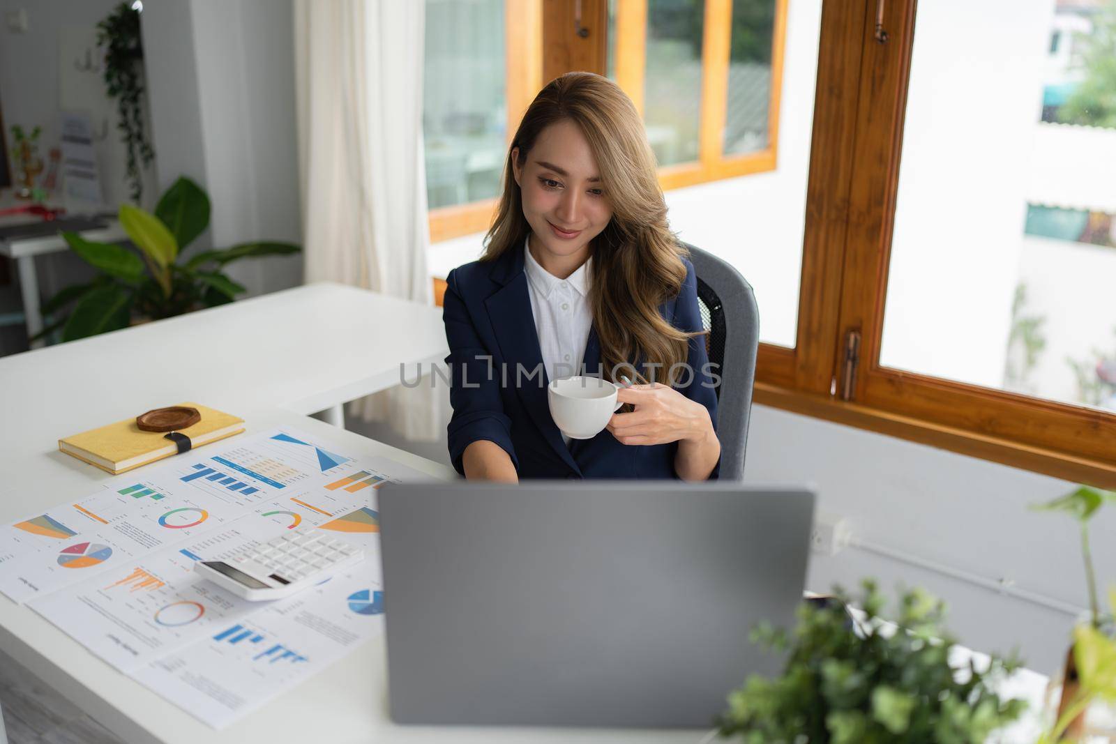 Business owner has online meeting with international partners