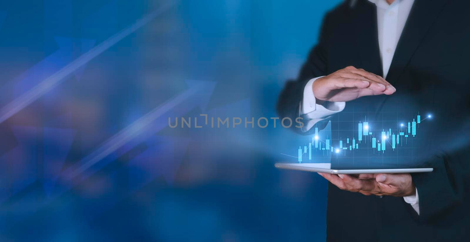 Hand of businessman holding tablet analysis stock market graph growth and increase of chart positive indicators. Hand holding tablet show stock chart on light gray background. copy space banner