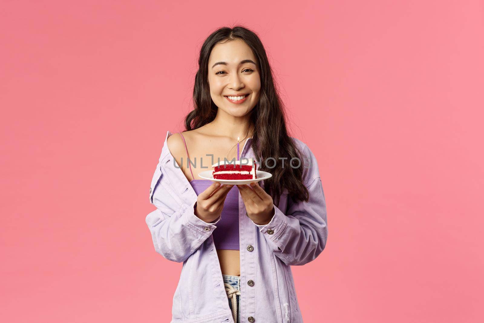 Eating-out, food and people concept. Portrait of joyful lovely, modern asian girl holding plate with cake, eat favorite dessert, laughing and smiling, likes sweet, standing pink background by Benzoix