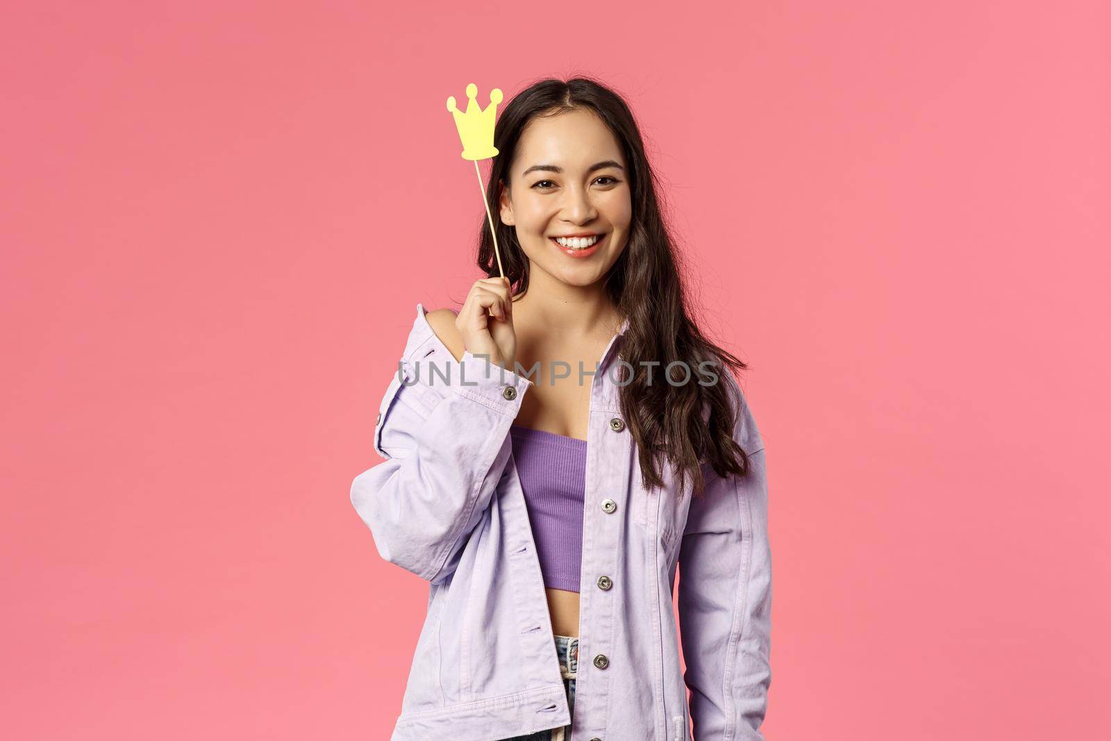 Holidays, lifestyle and people concept. Portrait of charismatic good-looking, stylish asian girl having fun, holding crown stick near head, feeling like little princess, smiling camera by Benzoix