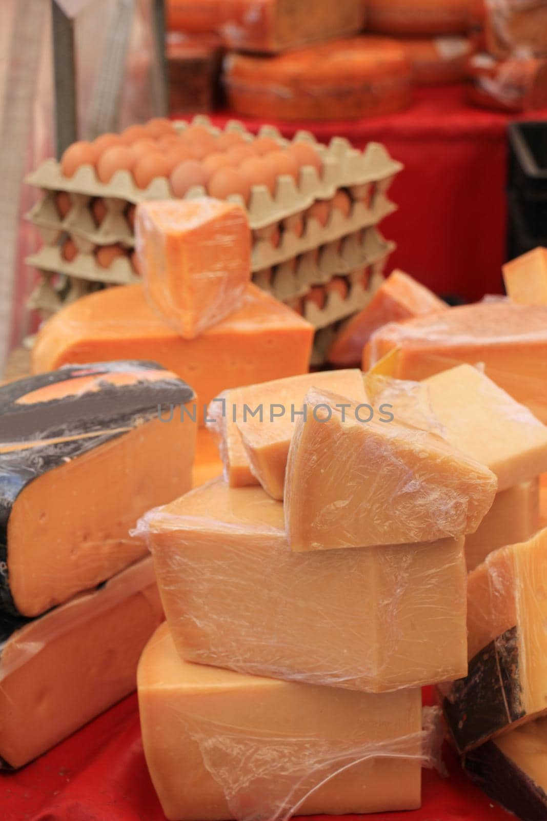 Traditional Dutch cheeses on display on a market stall