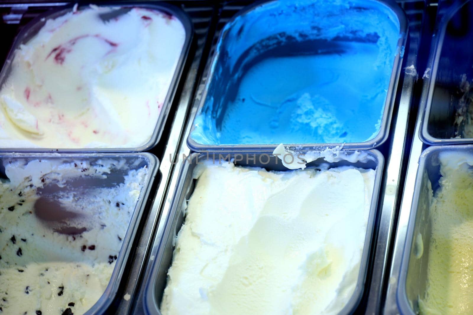 Assorted ice cream flavours on display in an ice cream parlour