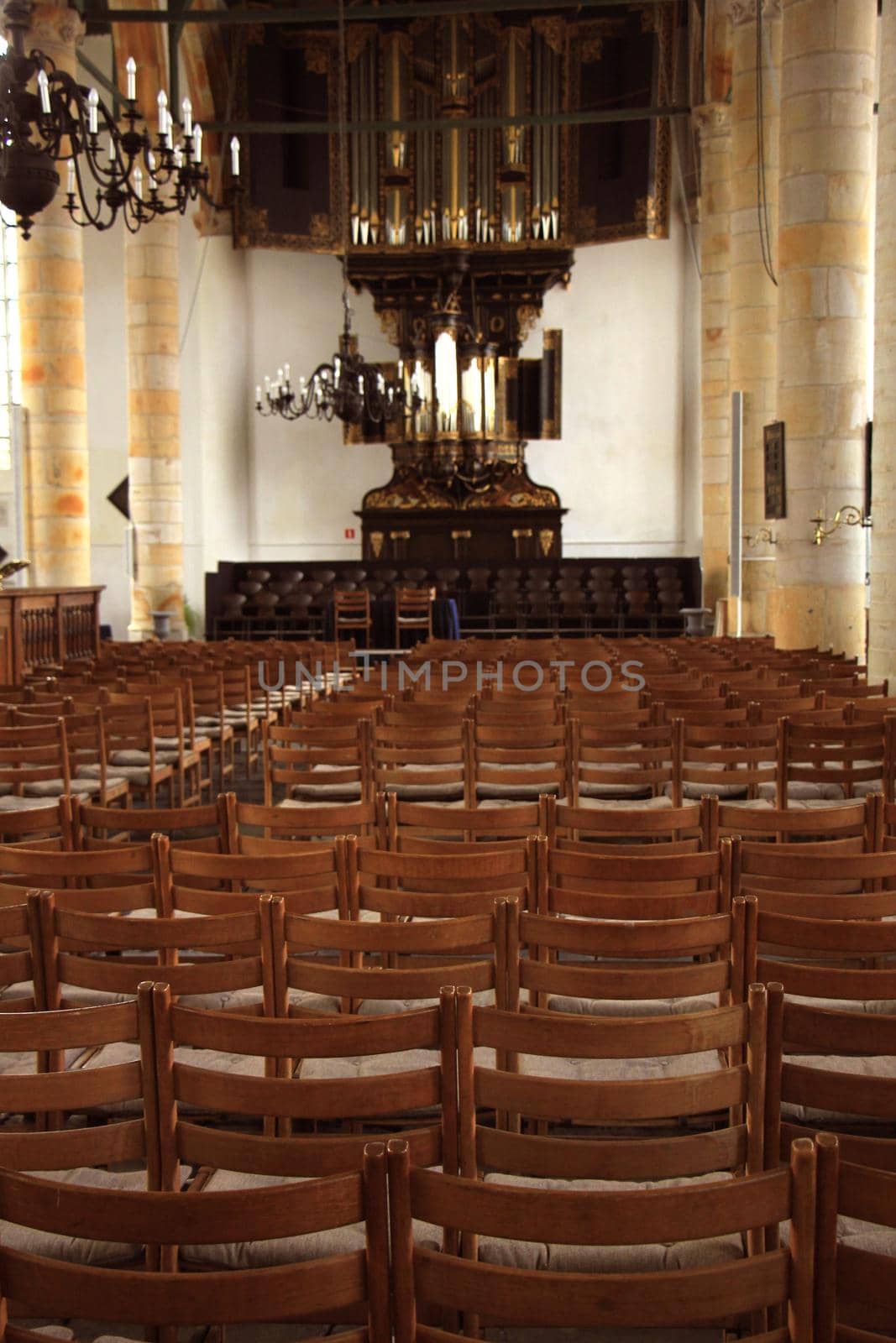 Simple wooden chairs in a Dutch Reformed Church