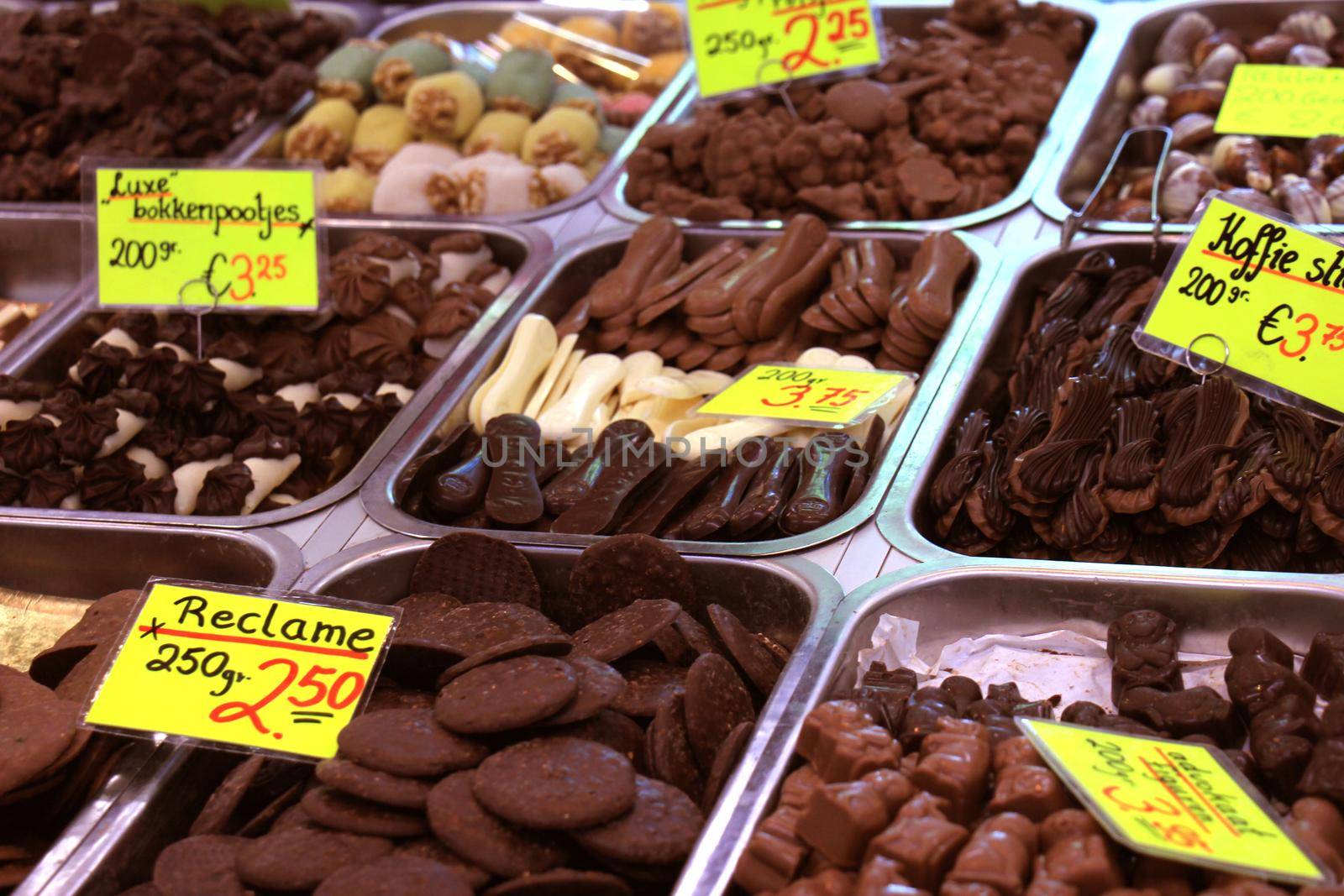 Chocolates on display on a confectioner's market stall (tags: prices and product information in Dutch)