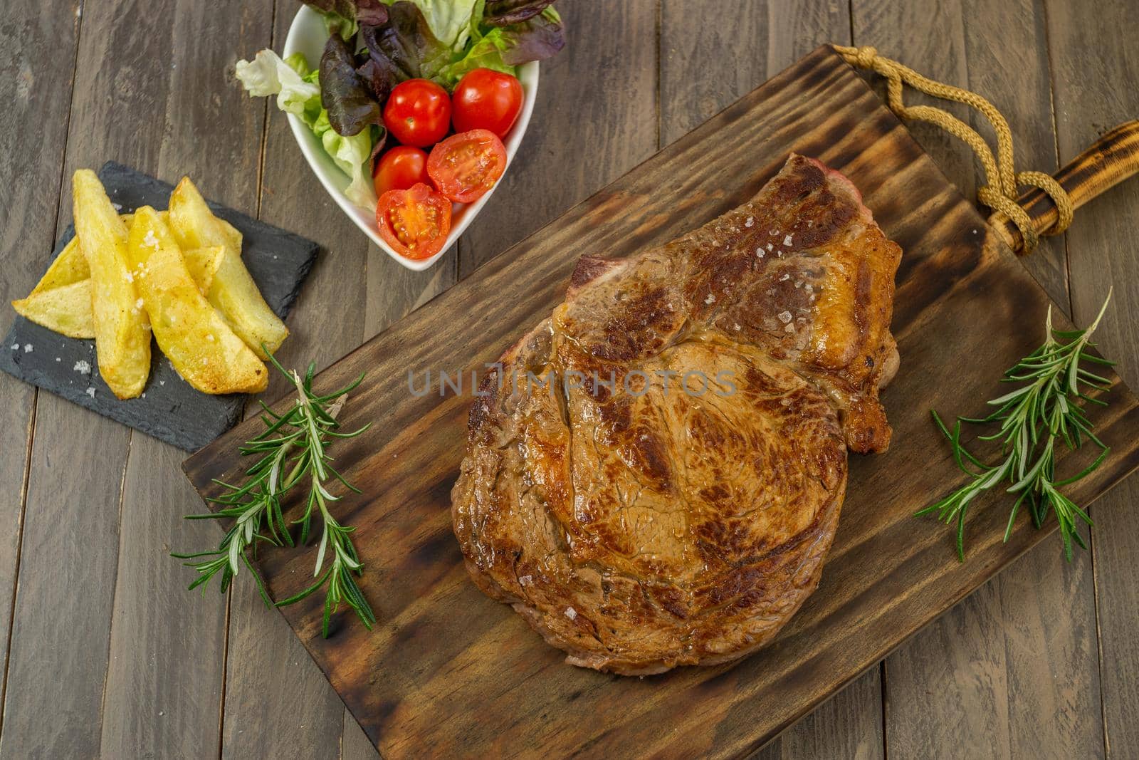 Veal cutlet from Avila, Spain with potatoes and vegetables juicy and tender