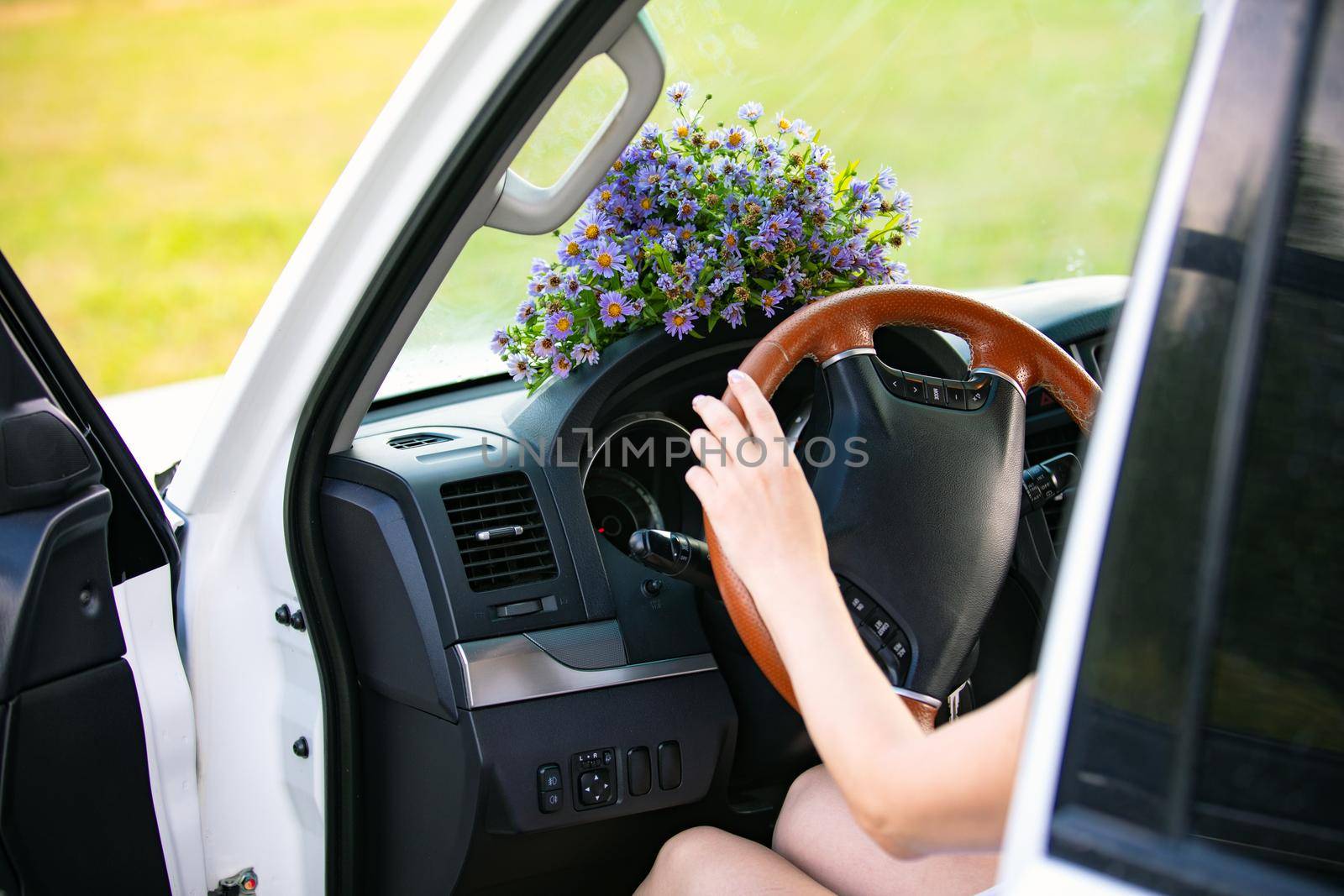 Bouquet of wildflowers on a dashboard of a car