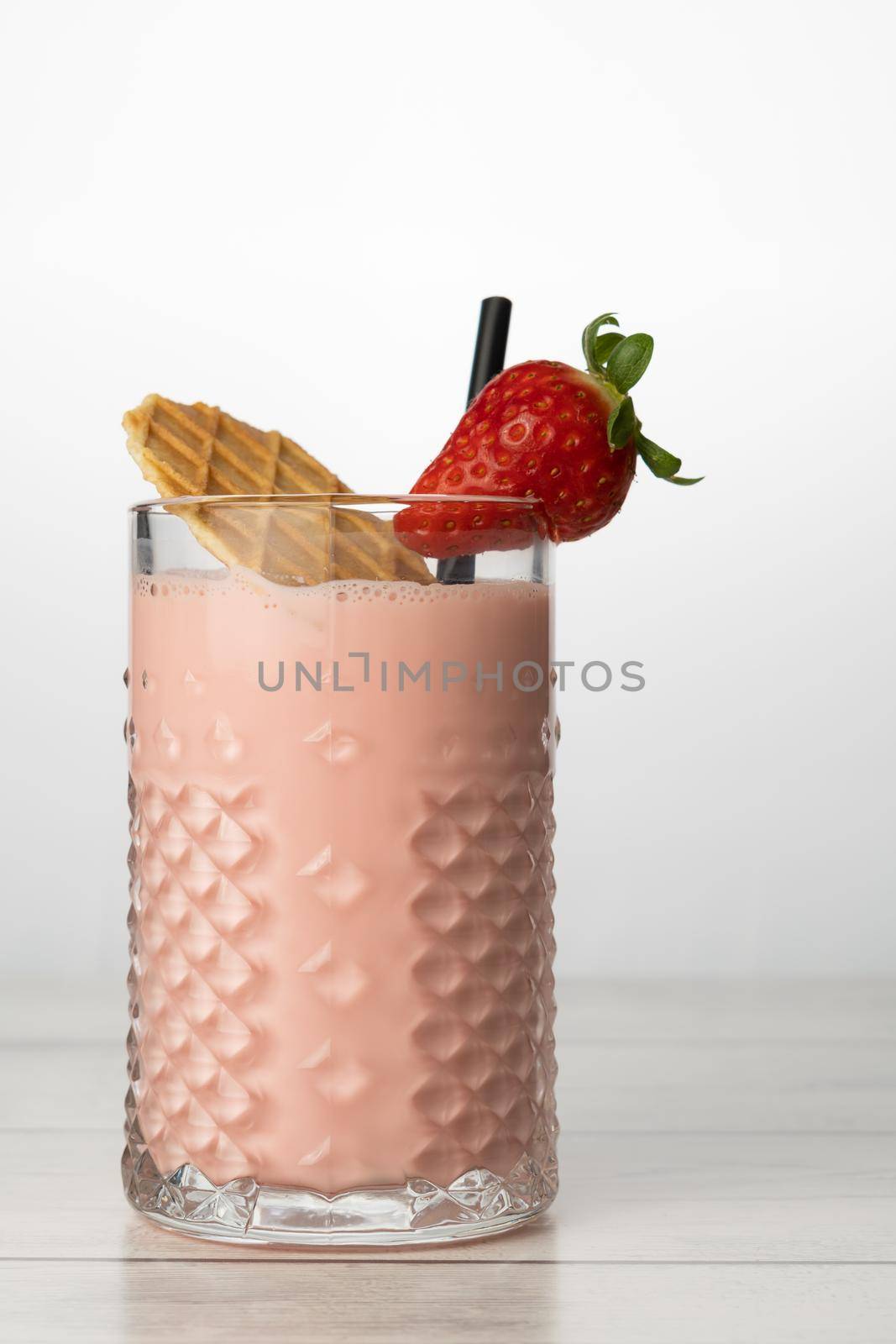 strawberry smoothie with natural fruit, white background and copy-space