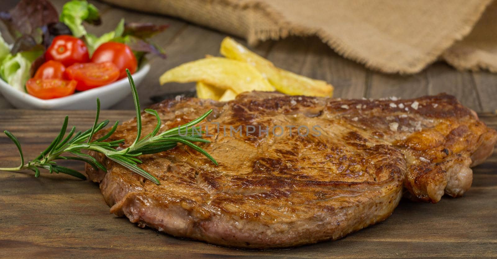 Veal cutlet from Avila, Spain with potatoes and vegetables juicy and tender
