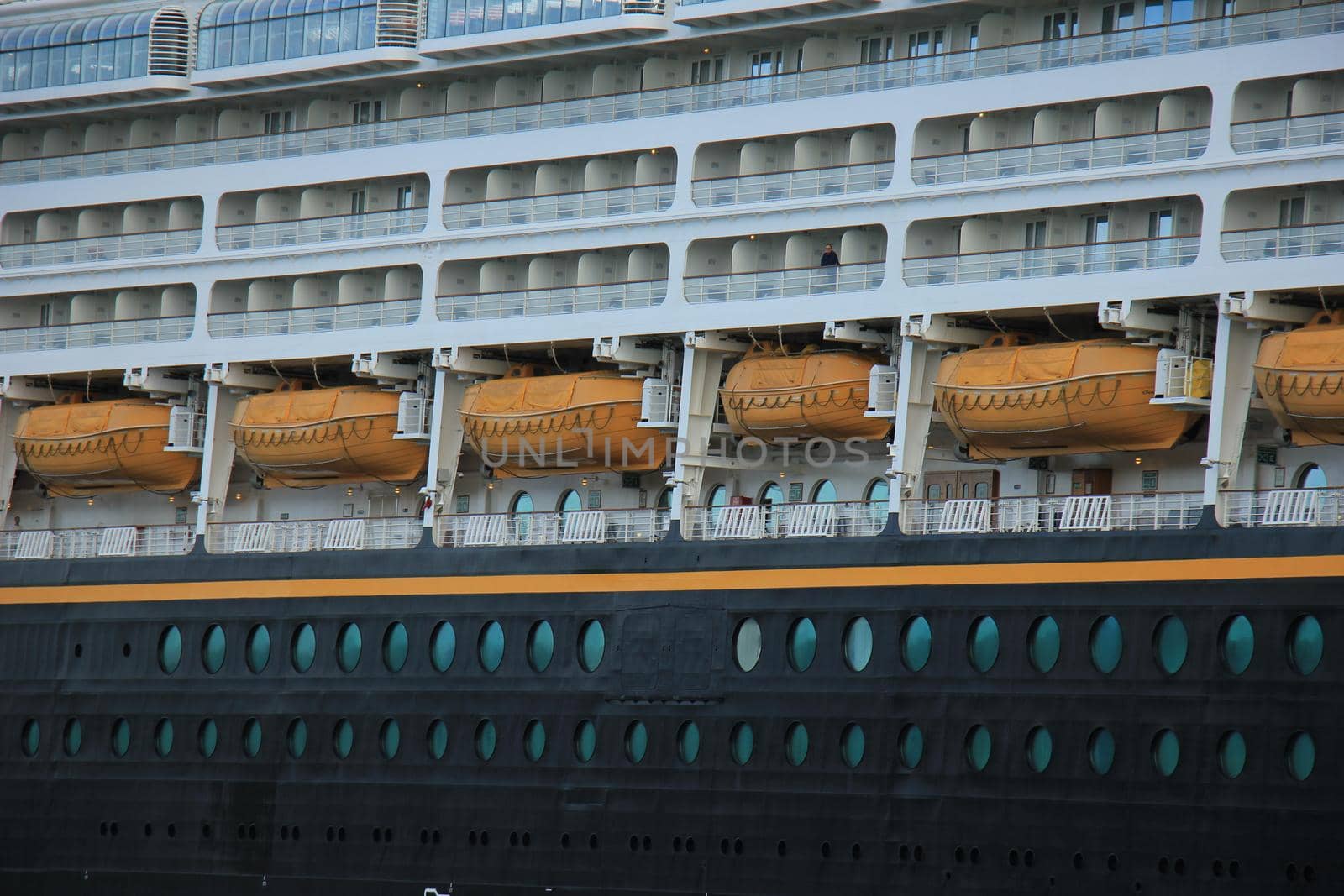 Velsen, the Netherlands - June, 27th 2017: Disney Magic on North Sea Canal, detail of cabins and lifeboats