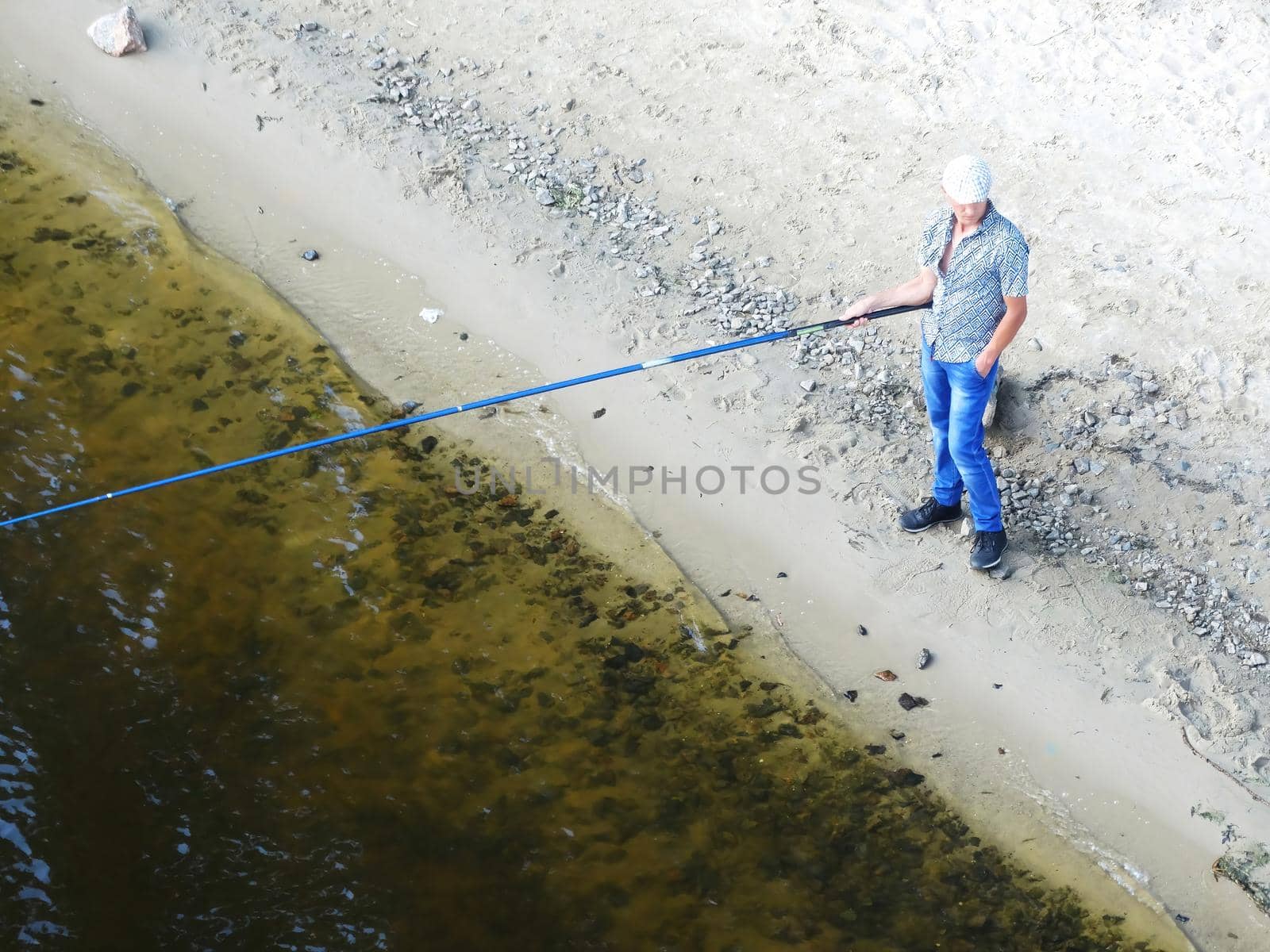 fishing rod lake fisherman men sport summer lure sunset water outdoor sunrise fish - stock image by mr-tigga