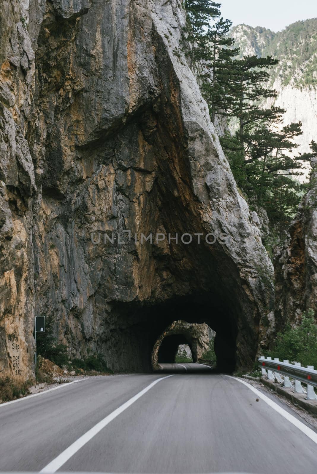 Empty route and small tunnel in mountain.