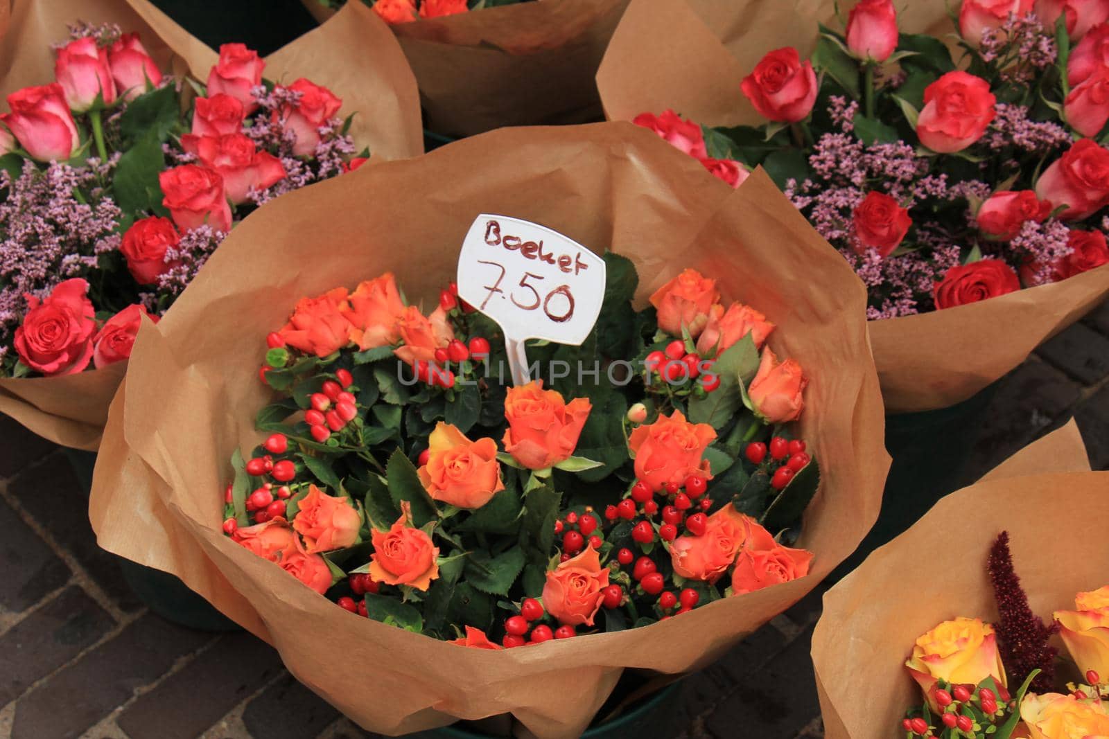 Bouquets with roses at a market by studioportosabbia