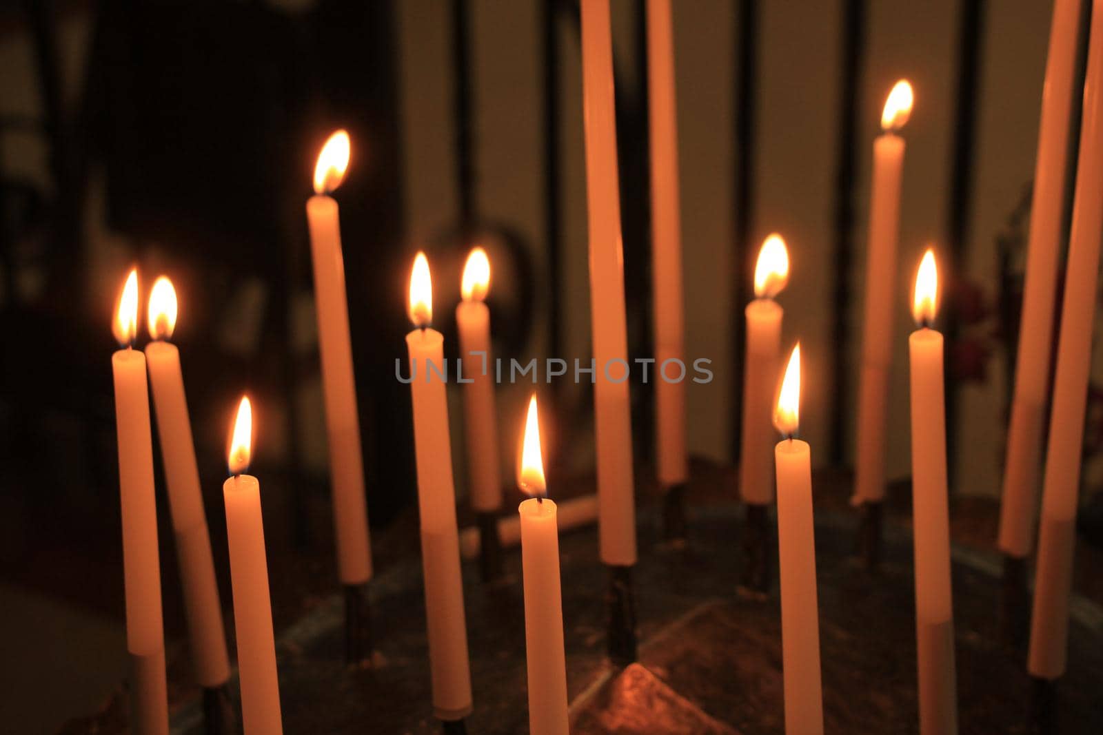 Long thin candles in a roman catholic church