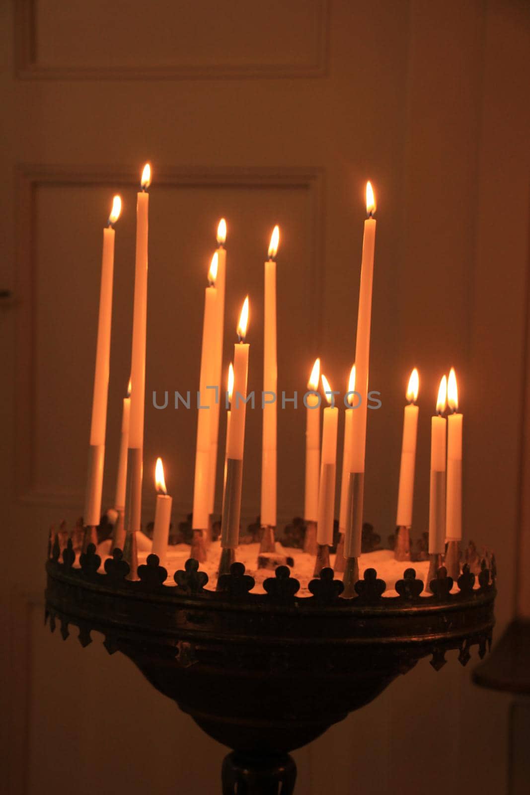 Long thin candles in a roman catholic church