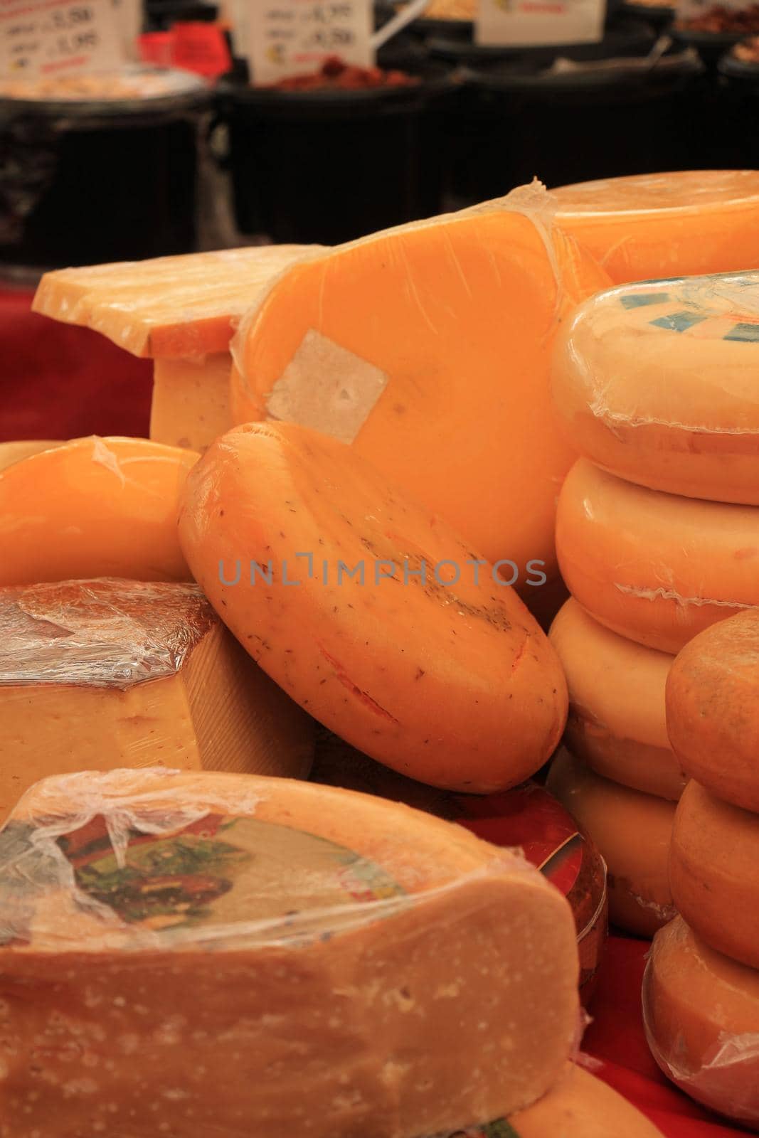 Traditional Dutch cheeses on display on a market stall