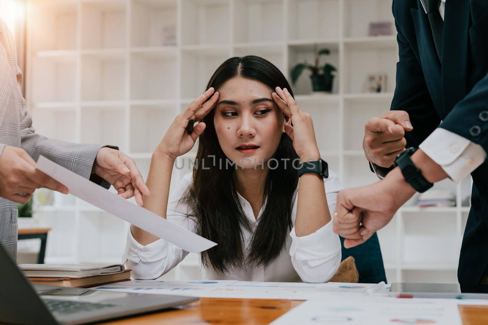 Young businesswoman unhappy and headache with excessive work.