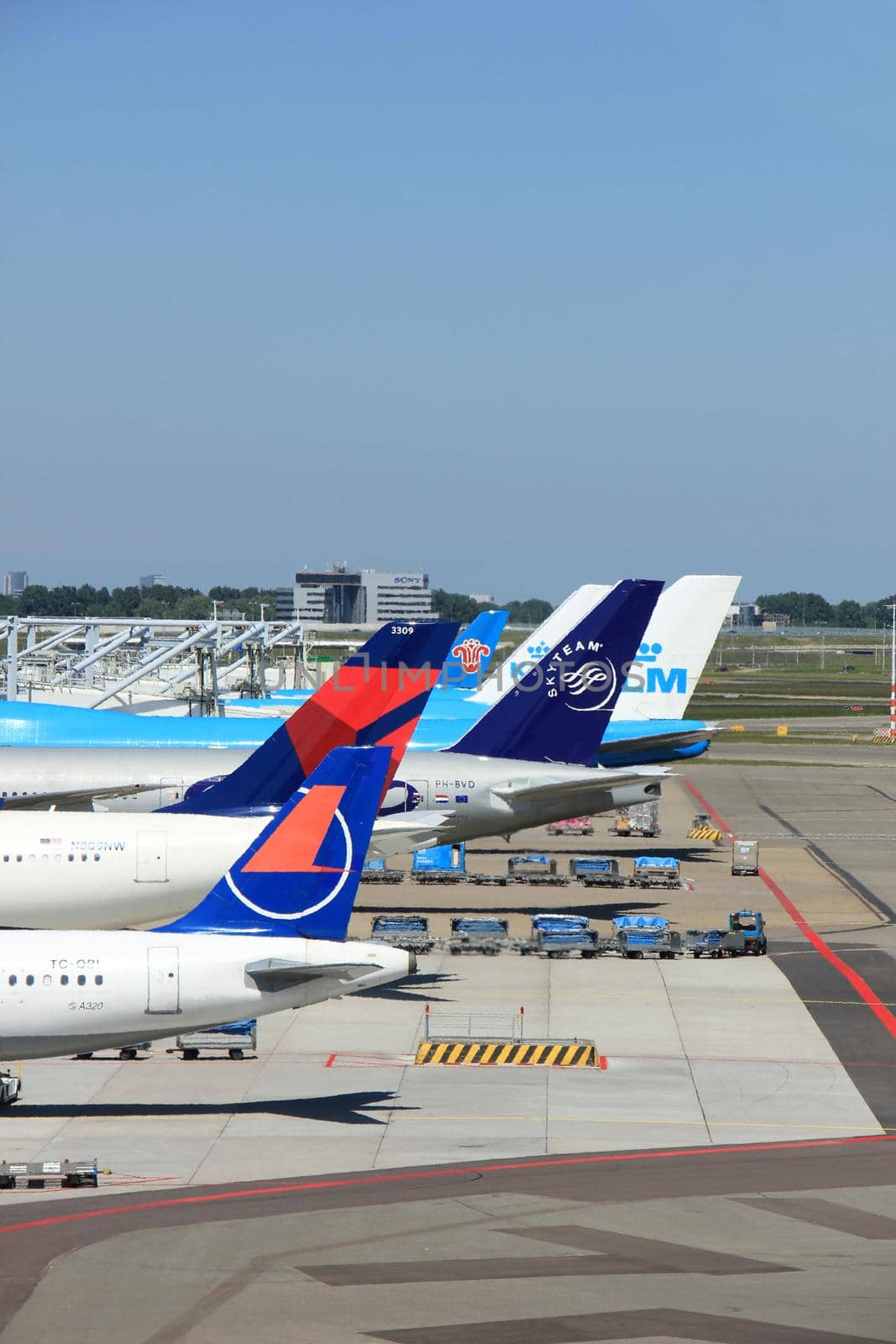 Amsterdam The Netherlands -  May 26th 2017: Planes of several major airlines parked at the gates at Schiphol Amsterdam International Airport