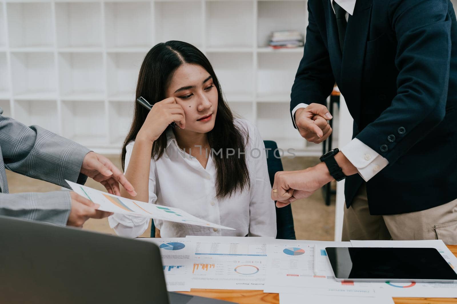 Young business asian woman unhappy with excessive work by nateemee