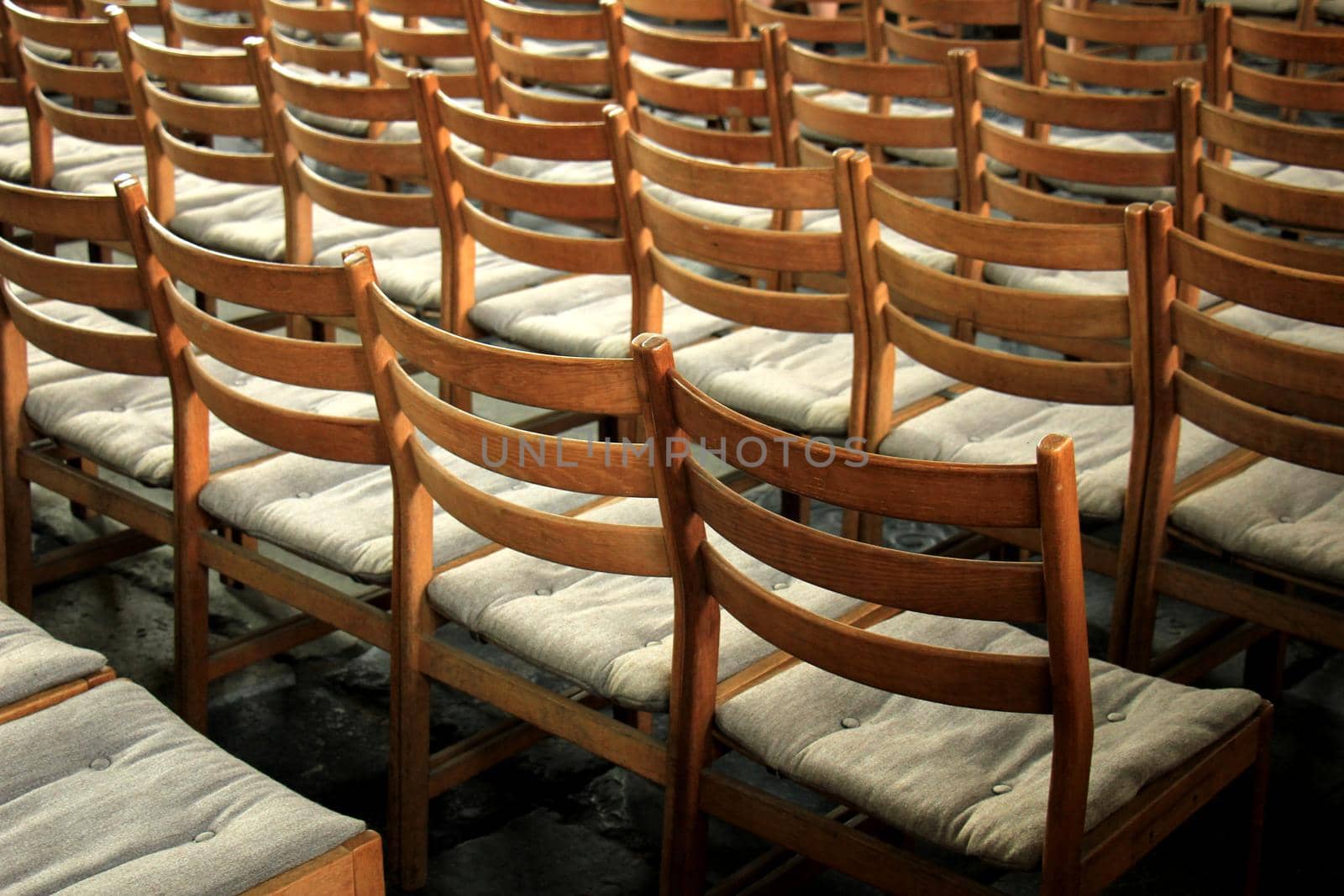 Simple wooden chairs in a Dutch Reformed Church