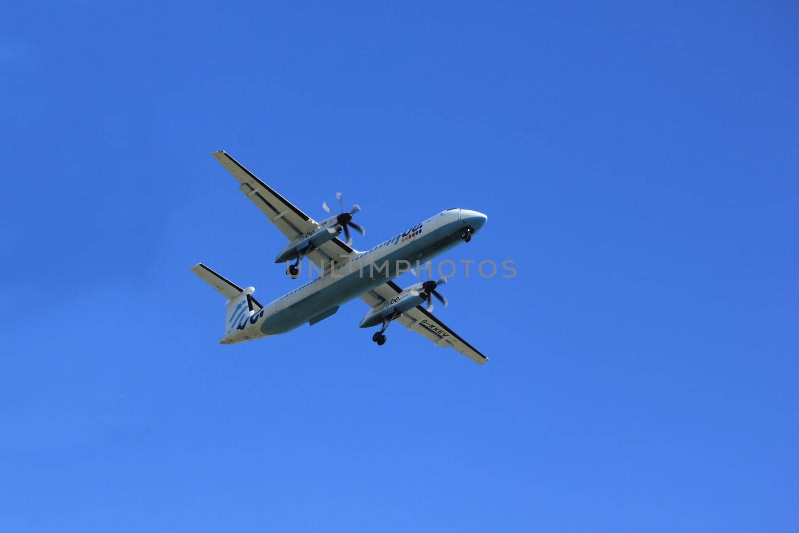 Amsterdam, the Netherlands - April 9th, 2017: G-KKEV Flybe De Havilland Canada DHC-8-402Q Dash 8 approaching Polderbaan runway at Schiphol Amsterdam Airport, the Netherlands