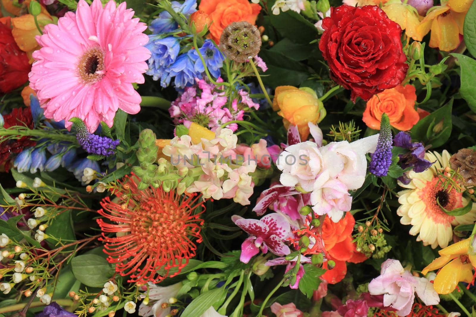 Multi colored wedding flowers in a decorative arrangement