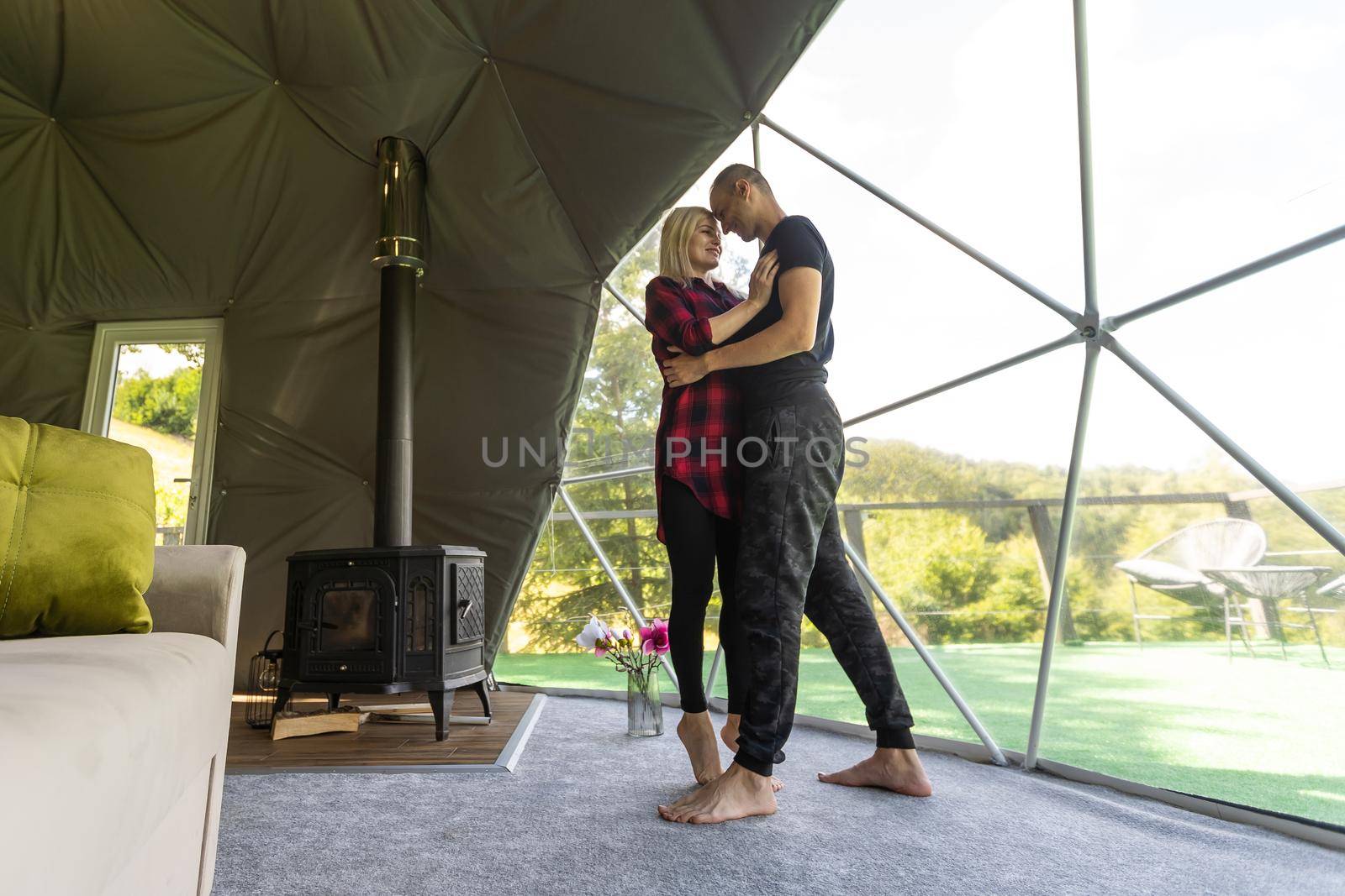 a couple dancing in geo dome tents