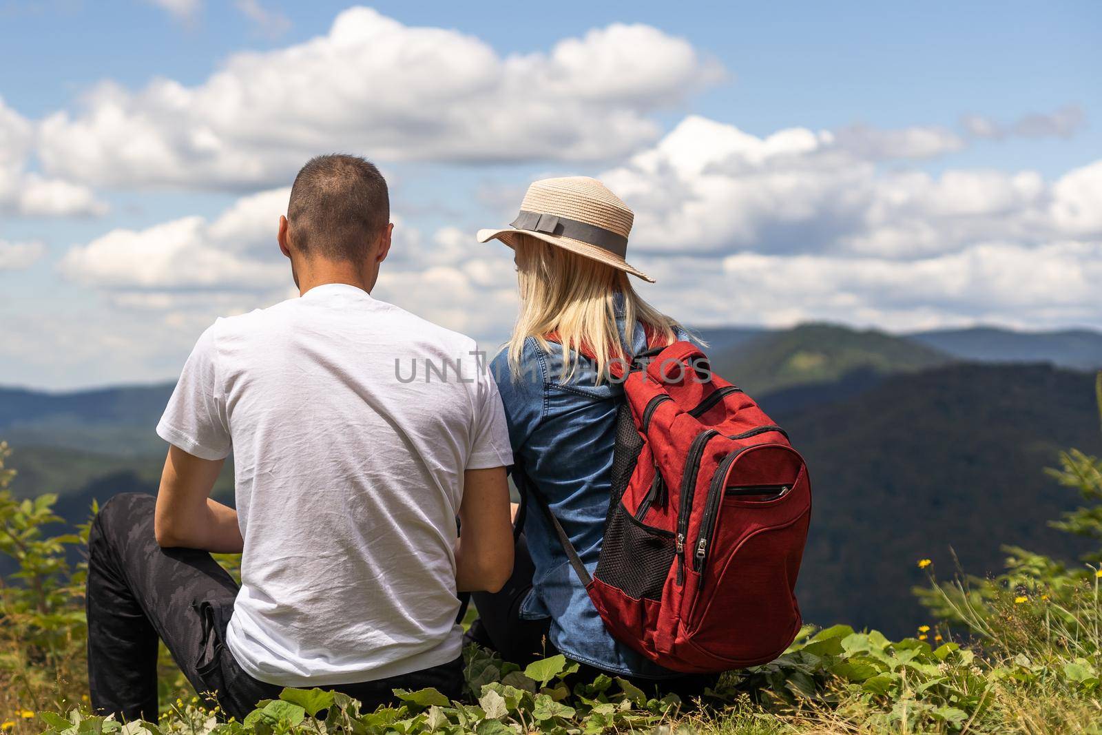 Couple travelers Man and Woman sitting relaxing mountains, view Love and Travel happy emotions Lifestyle concept. Young family traveling active adventure vacations by Andelov13