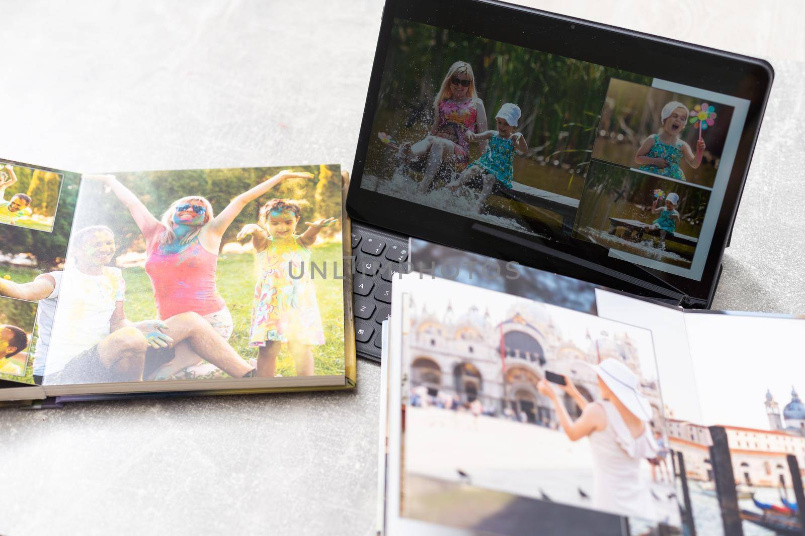 photobook album and tablet on the table.